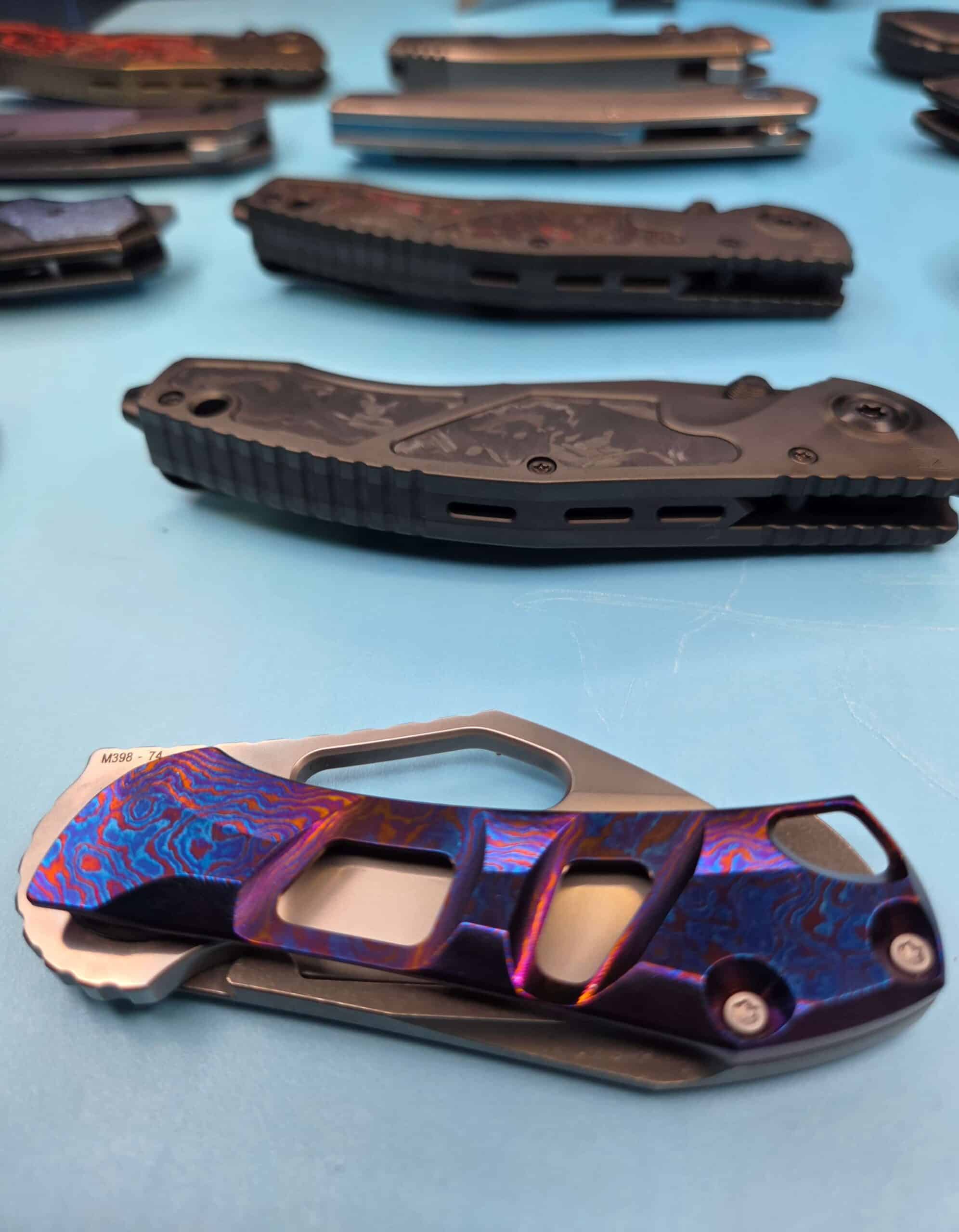 Custom Knife Factory collection of custom knives displayed together