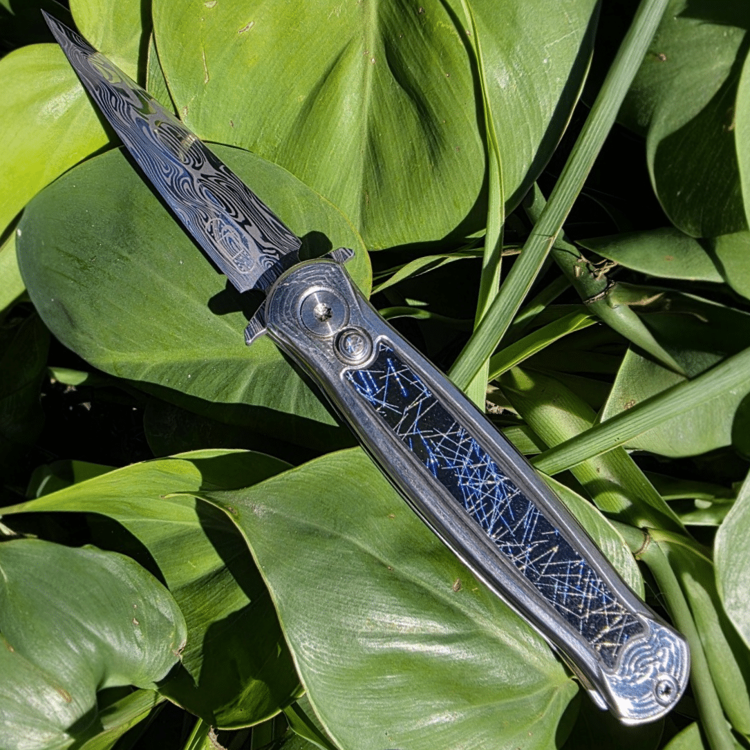 RMOR Knives Skunk custom folding dagger with Loki Damascus blade and phenolic carbon fiber inlay