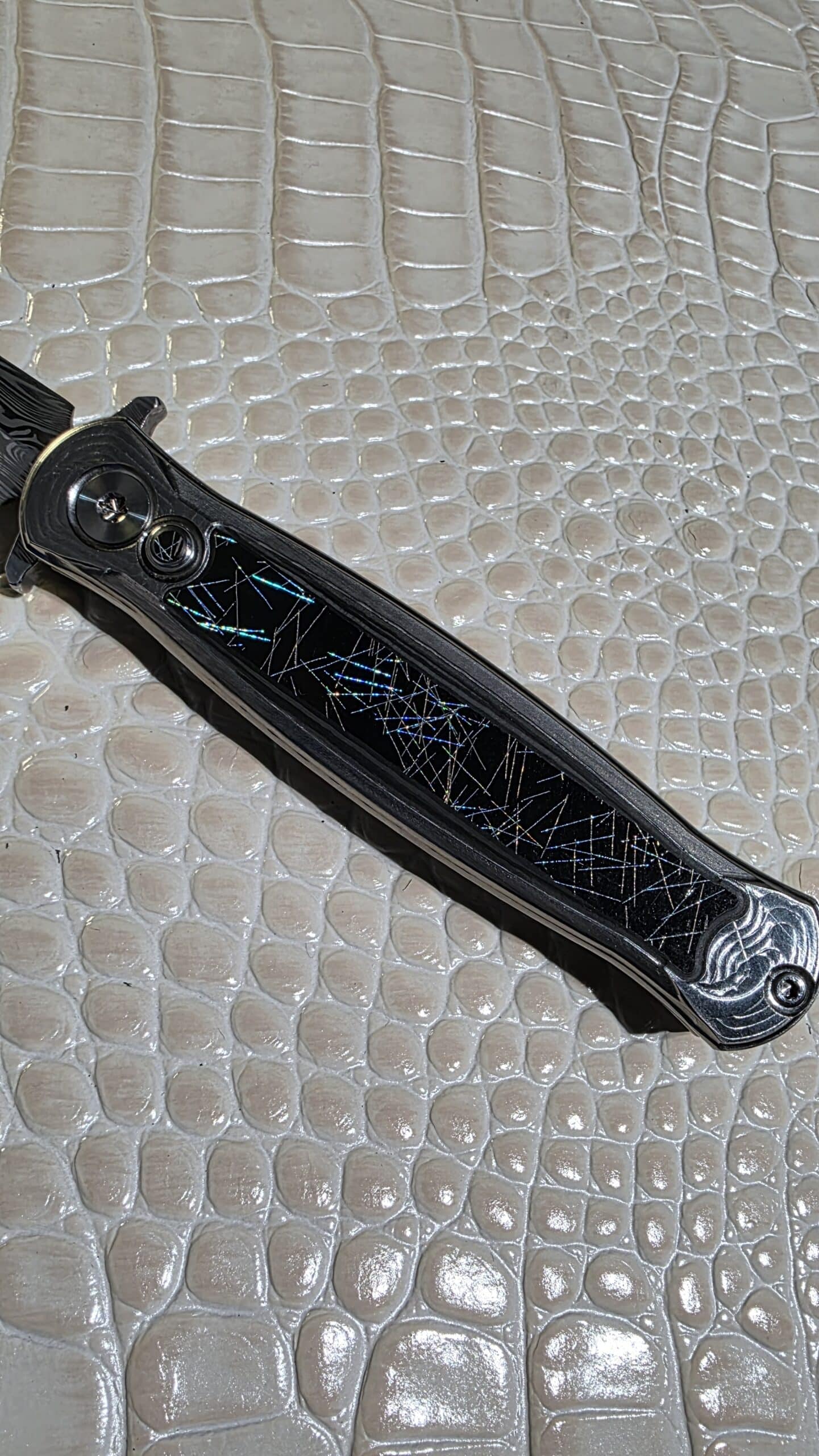 RMOR Knives Skunk custom folding knife with Loki Damascus blade and chaotic carbon fiber inlaid titanium handle