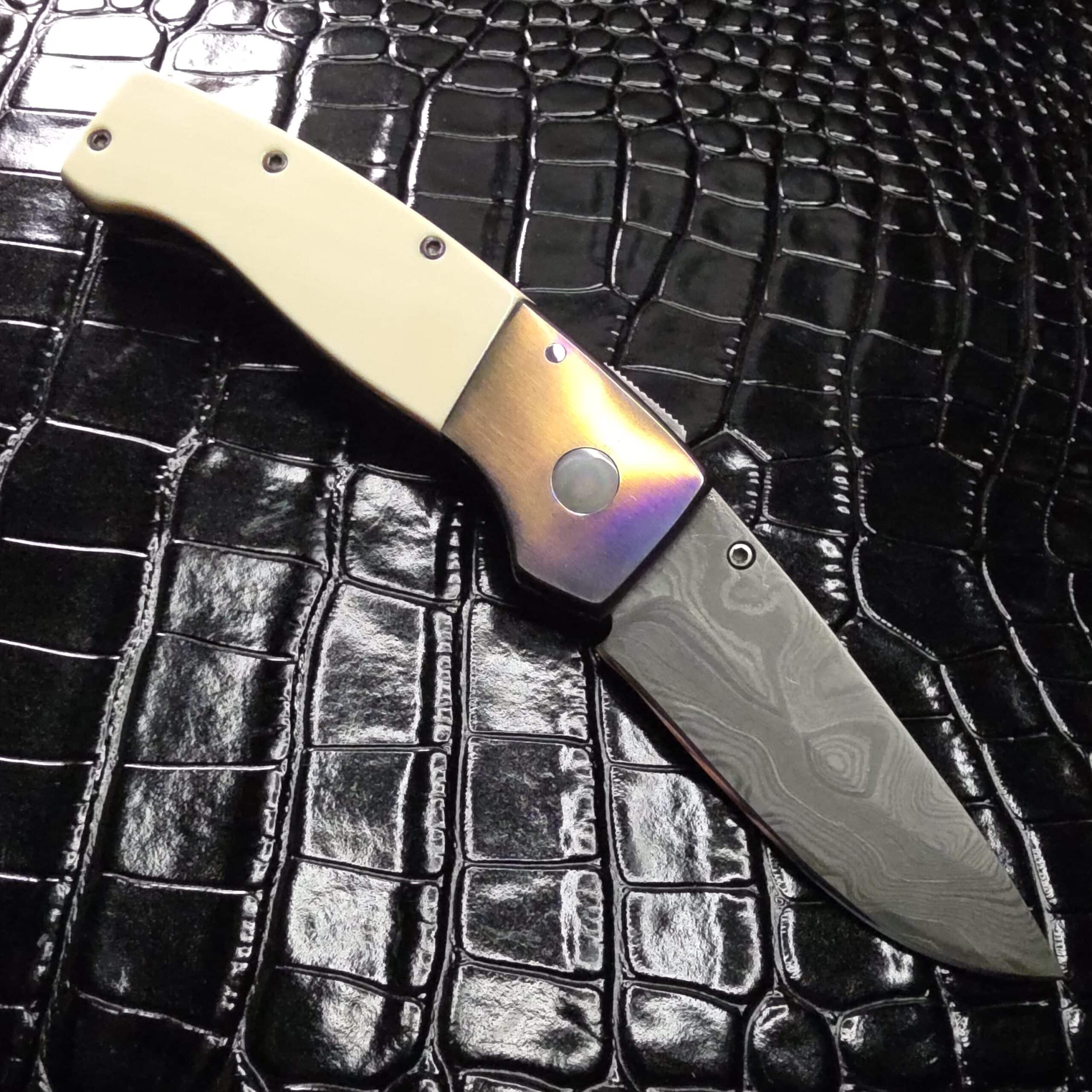 Kit Carson custom knife open with 3 inch Damascus blade and Garbo 1990 scrimshaw ivory scales