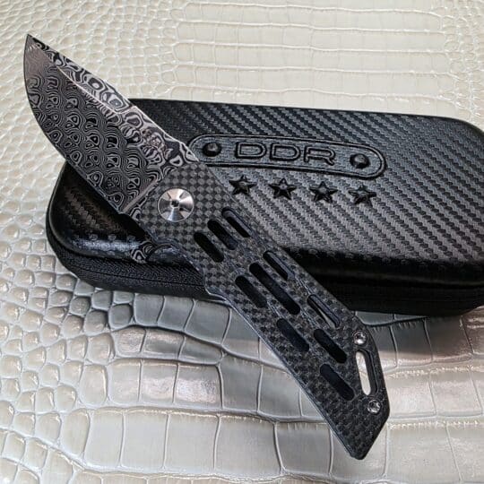Darrel Ralph Custom Dominator Ventilator 2 hero photo showing Damasteel blade and ventilated carbon fiber show side