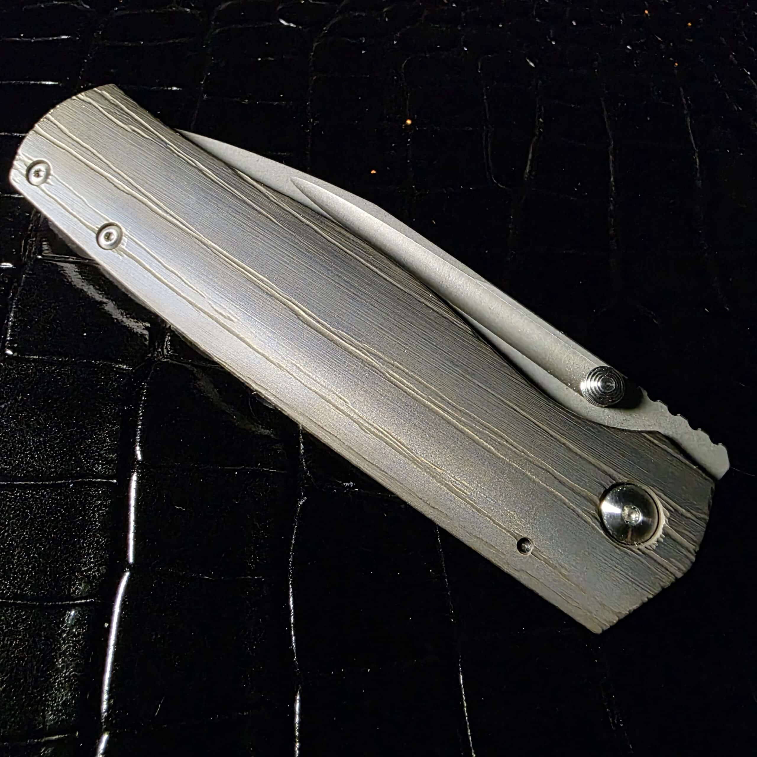 Ray Laconico Custom Albatross closed view showing stonewashed titanium frame lock scales and pocket clip