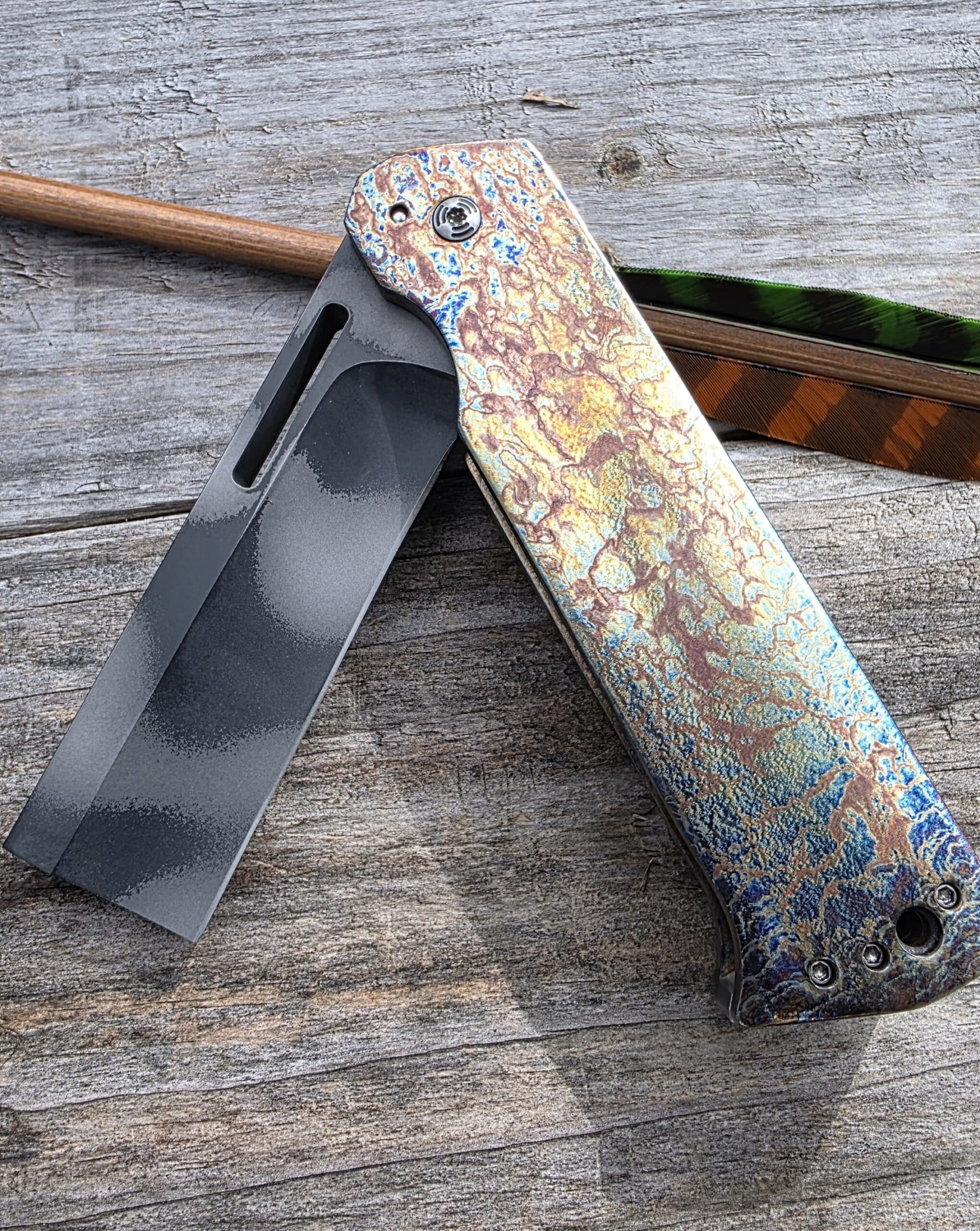 Vertical artistic shot of the Reese Weiland Custom Fatty Slasher Flipper knife.