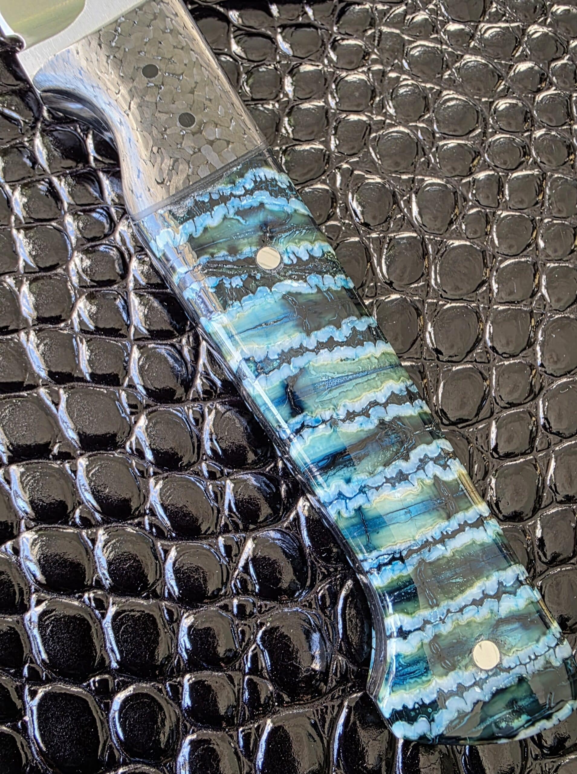 Extreme close-up of stabilized mammoth tooth on the Holley Hunter handle.