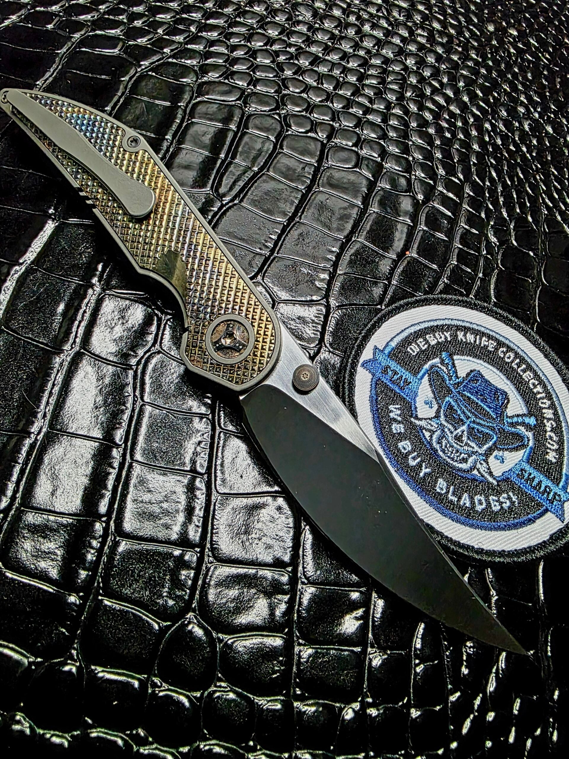 Clip side of Hypercut Manufacturing Bikkhu showing the titanium frame lock and clip.