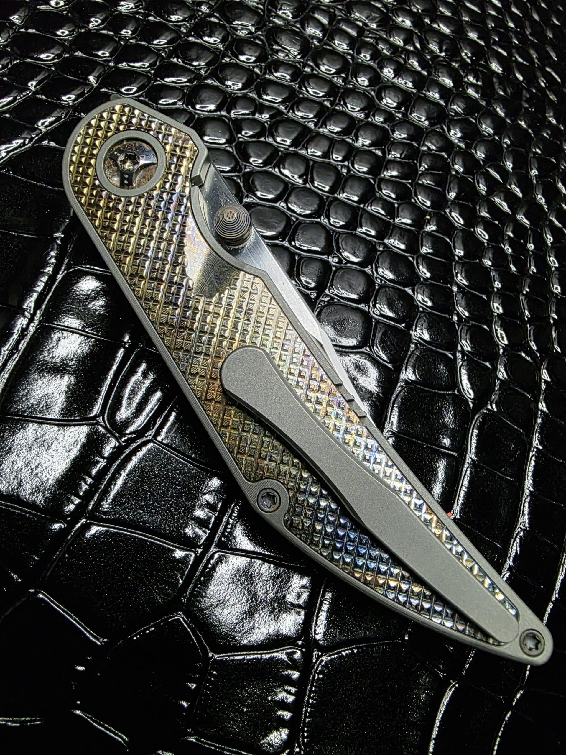 Top-down view of the titanium pocket clip on the Bikkhu.