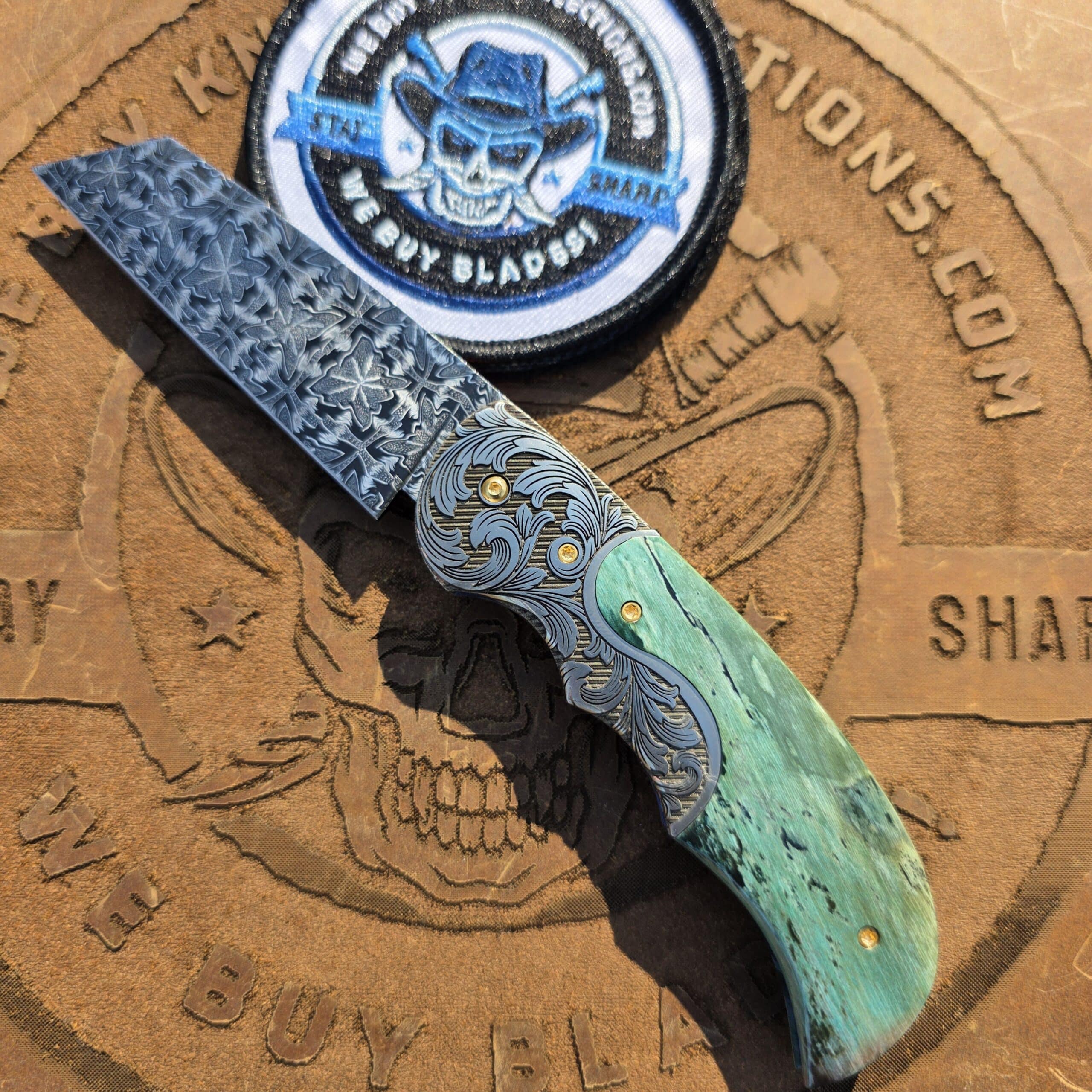 Curt Zimmermann Custom Folder with Butterfly Damascus blade and premium mammoth scales.
