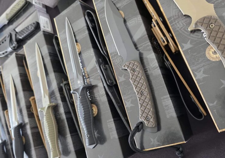 Custom knife collection laid out for appraisal to determine current market value