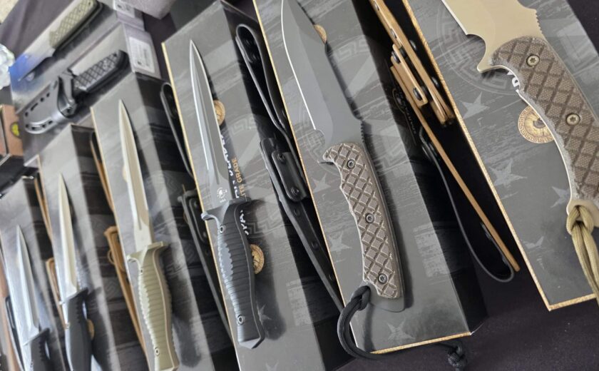 Custom knife collection laid out for appraisal to determine current market value