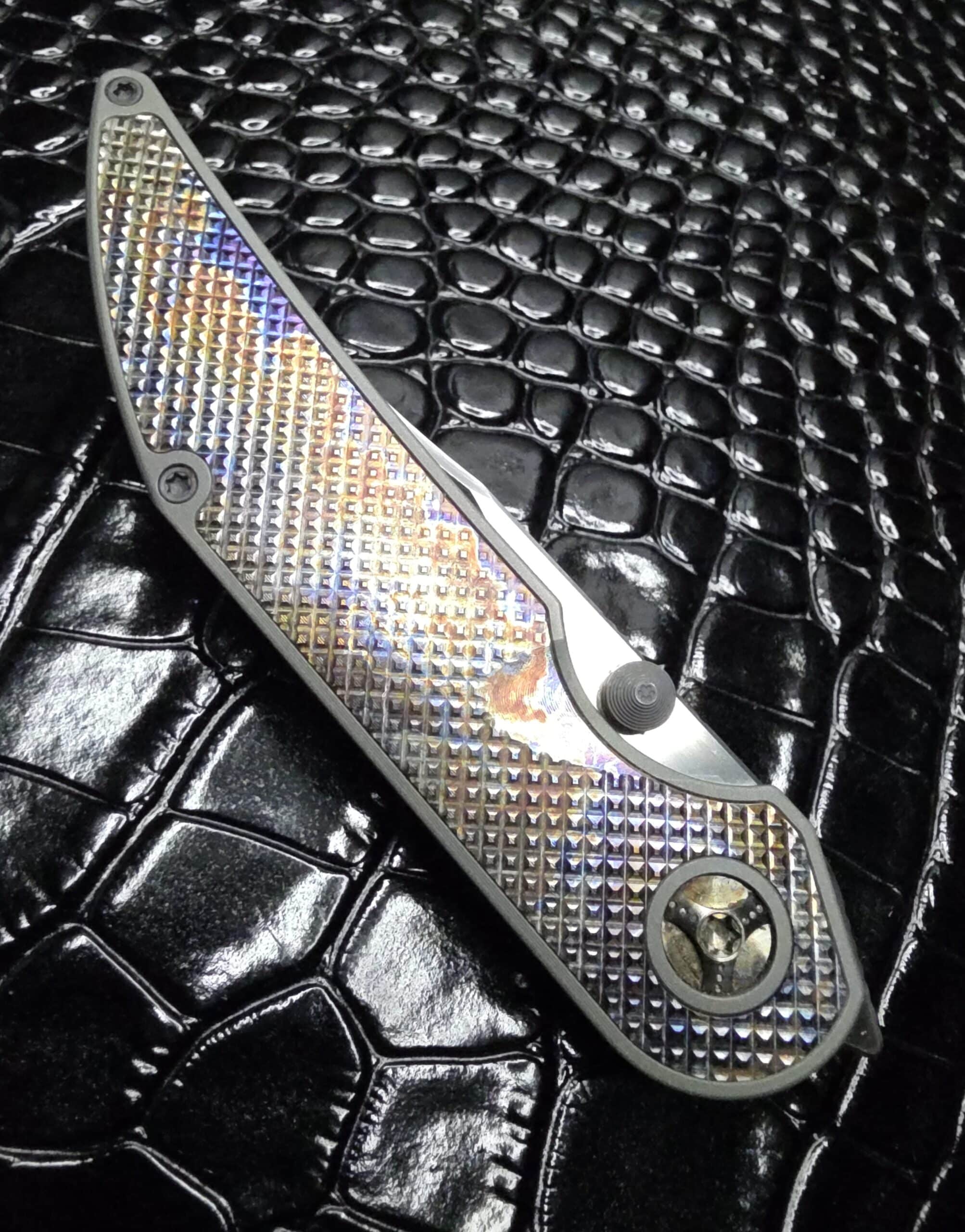 Vertical artistic shot of the Hypercut Manufacturing Bikkhu Custom Knife.