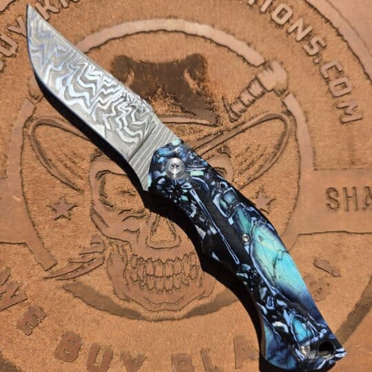Eliot Maldonado Custom Fixed Blade featuring Baker Forge Tiger Twist Damascus and parallel cut mammoth ivory scales.
