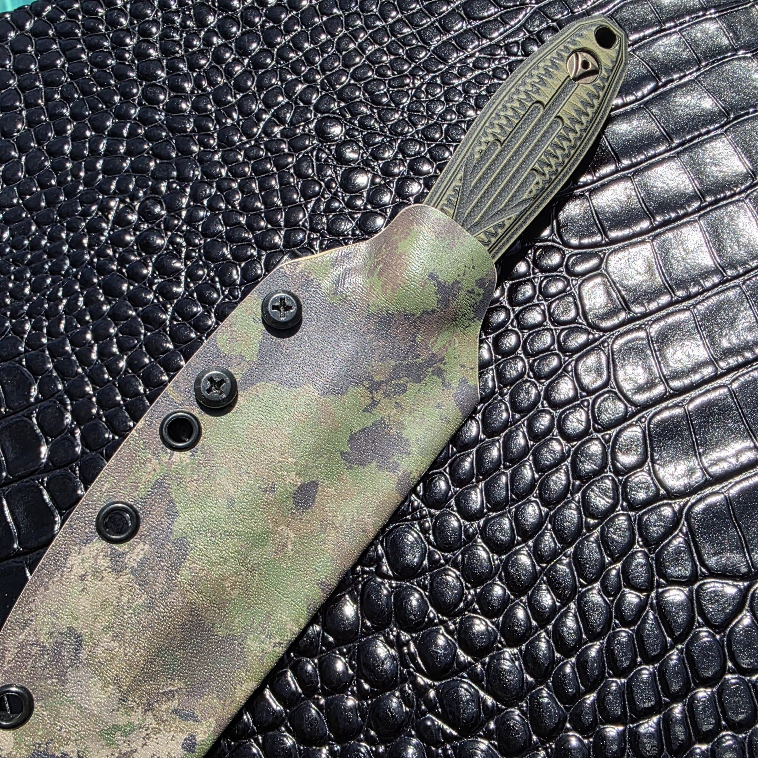 The JB Stout Stengah Dagger secured in its custom OD green Kydex sheath.