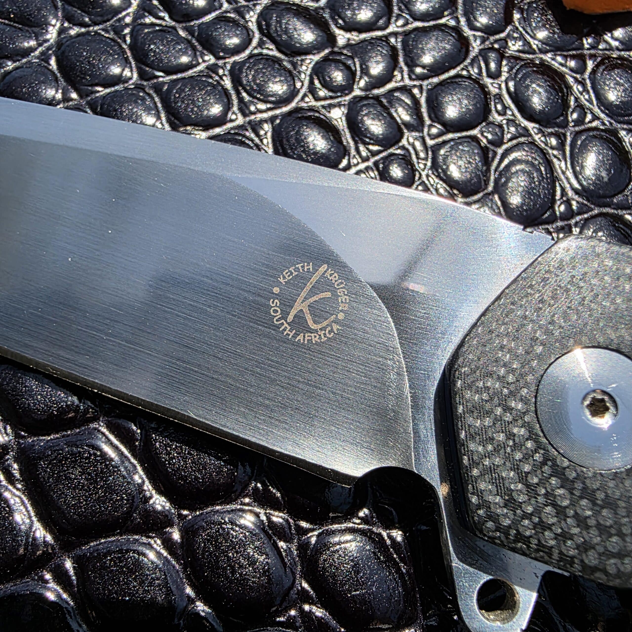 The Keith Kruger maker mark etched on the blade of the K4 custom.