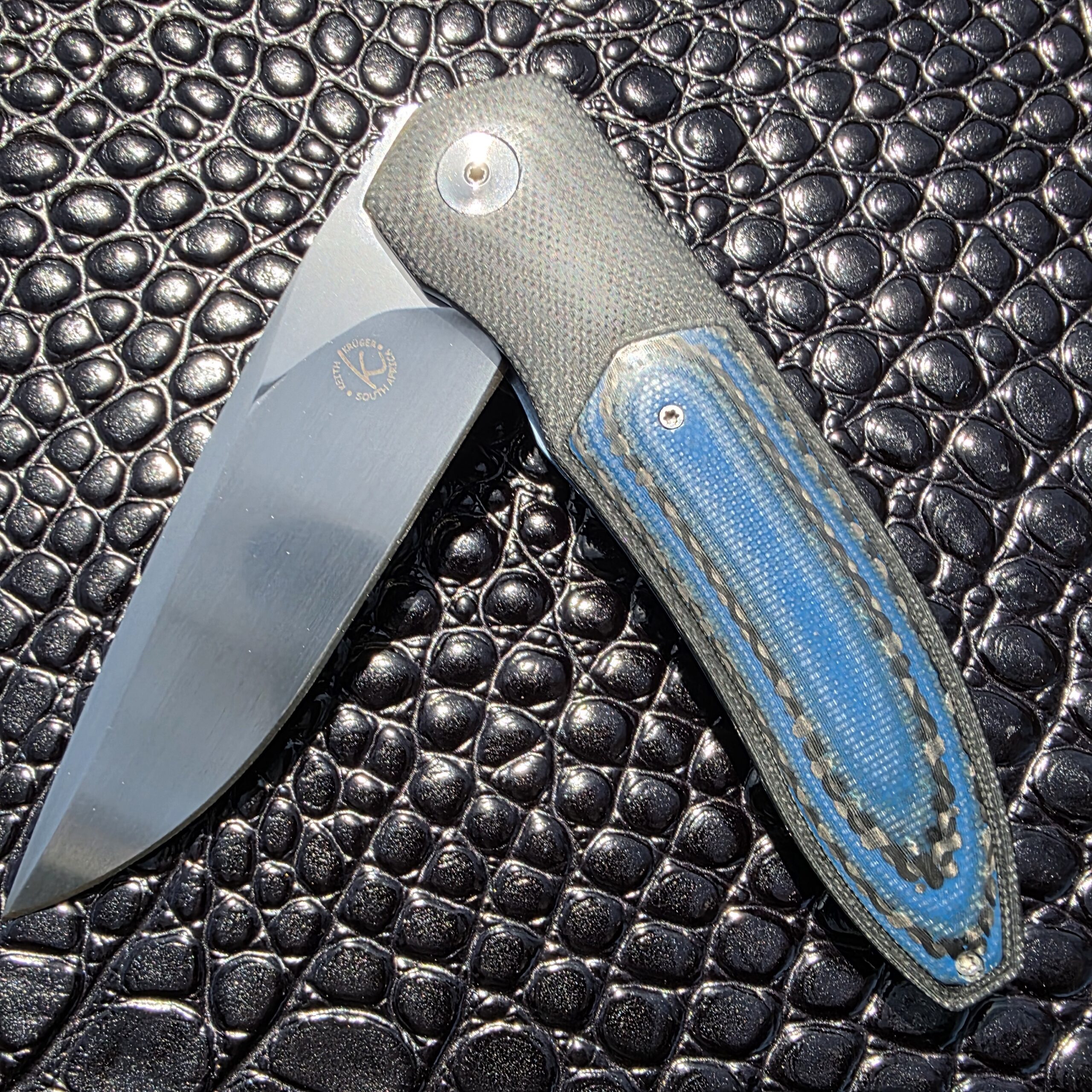 Artistic macro shot of the Keith Kruger K4 blade and handle.