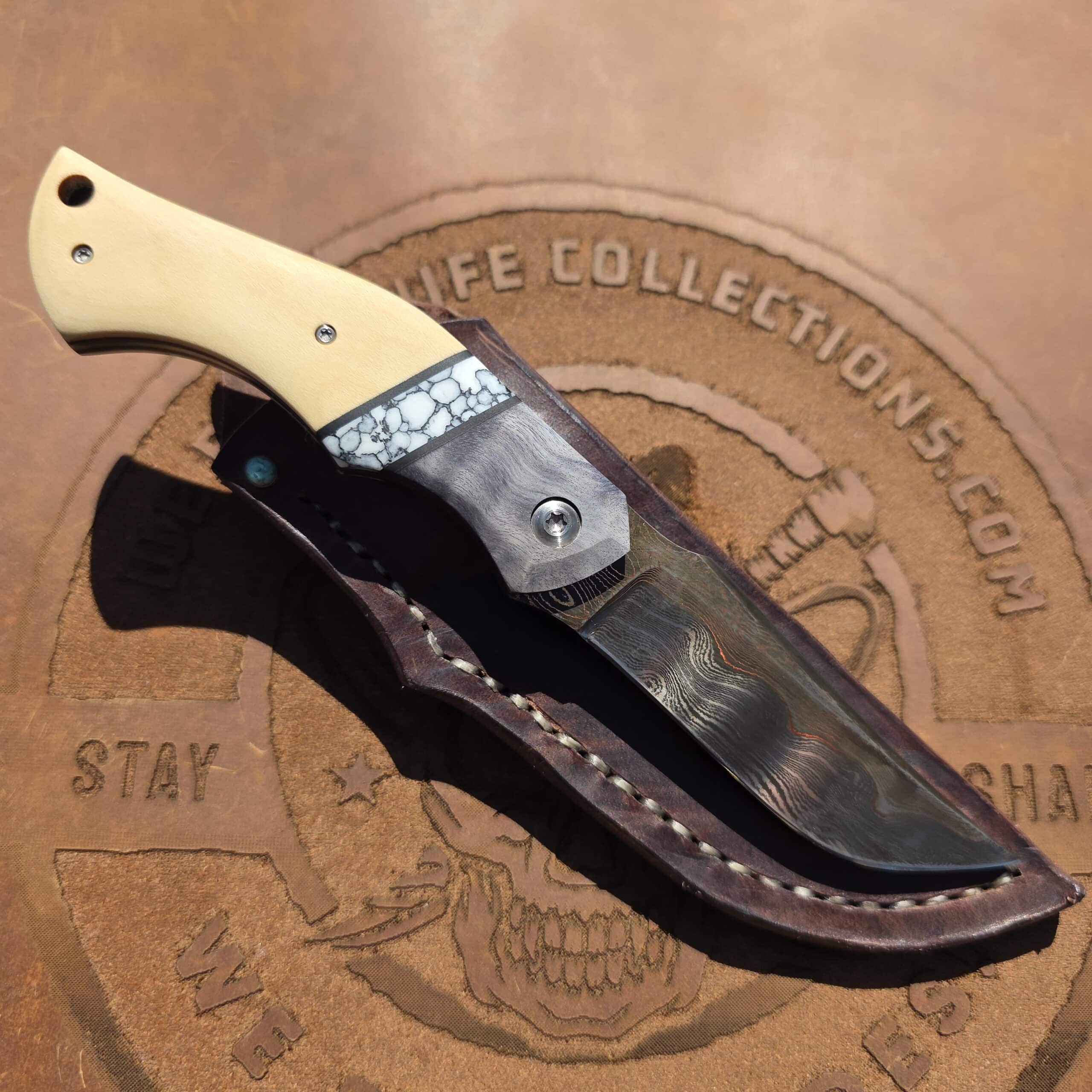 E.F. Maldonado Cu-Mai fixed blade in its handmade leather sheath with Turquoise accent.