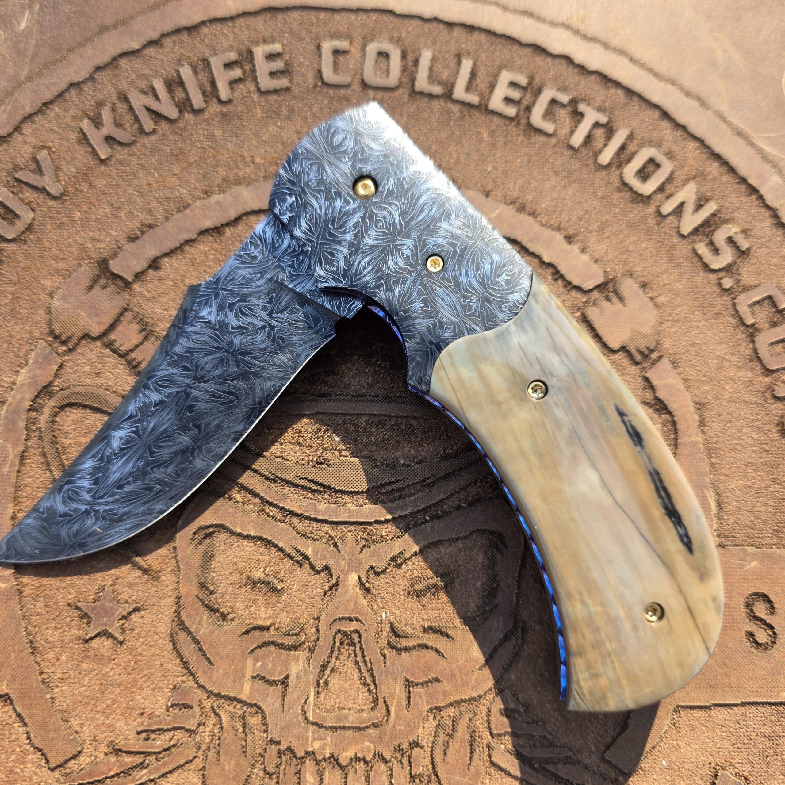 Close-up of the mosaic Damascus texture on the bolster.