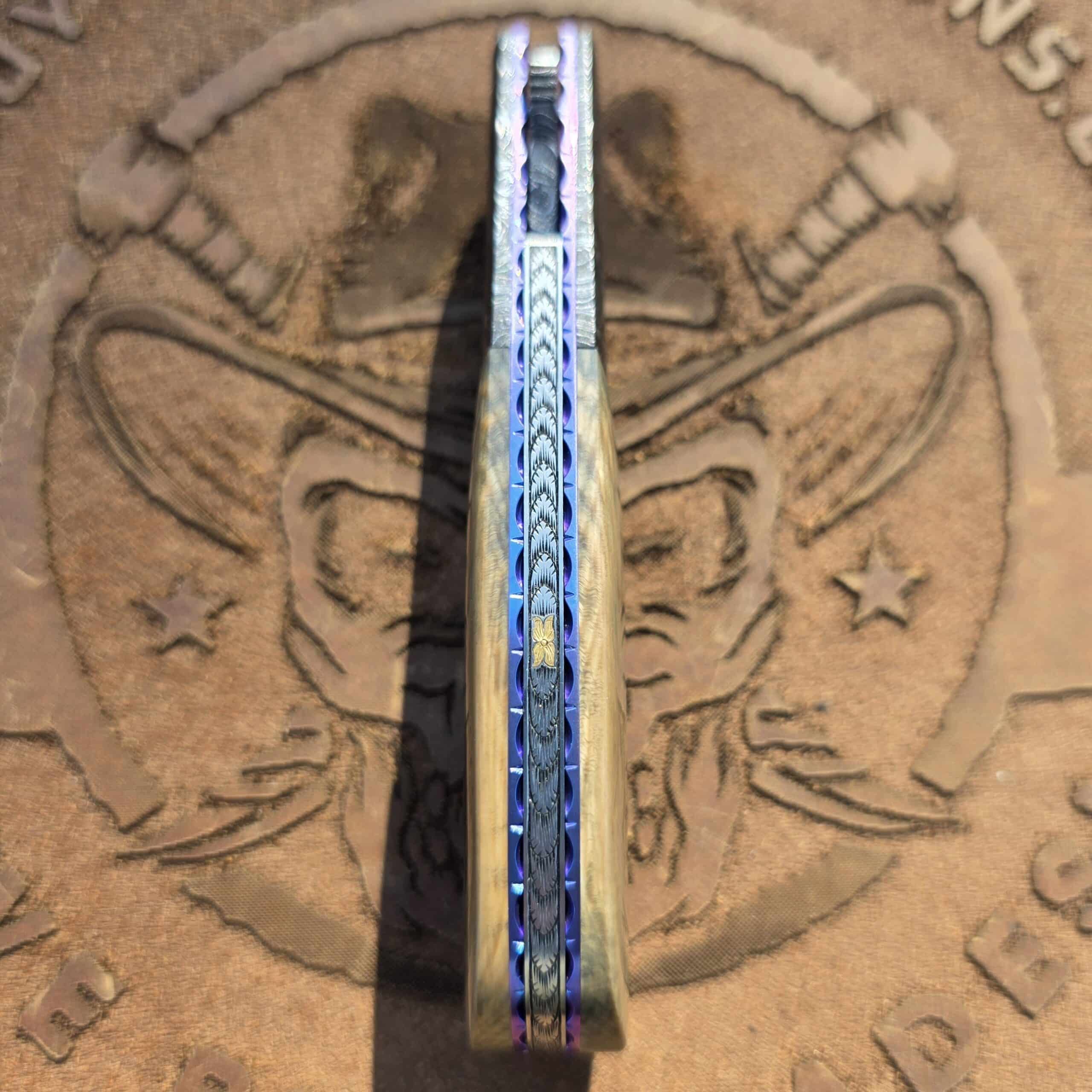 24k gold accent and custom file work on the spine of a Sukattuk Flipper.