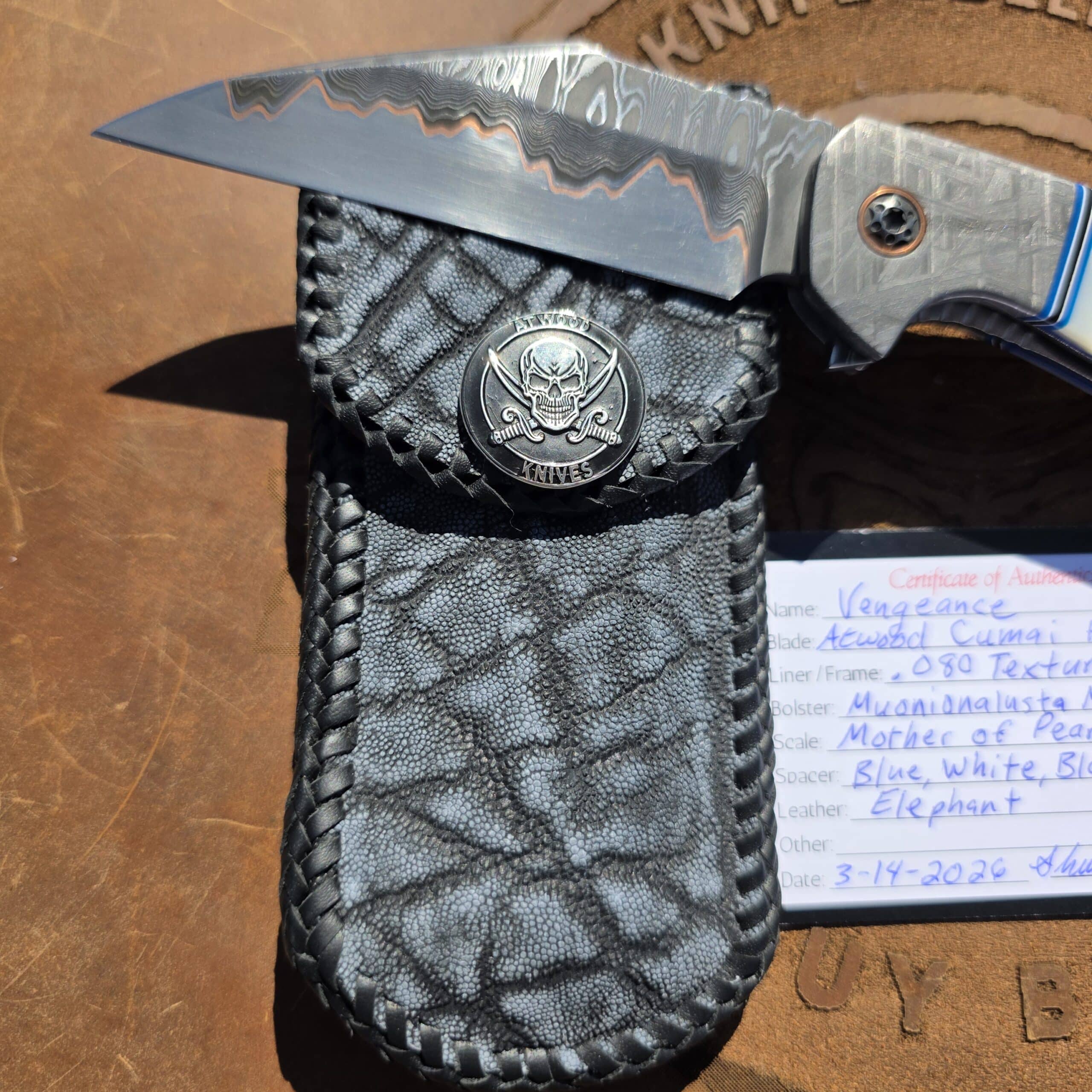 The Shane P. Atwood Vengeance custom knife displayed with its magnificent elephant skin case.