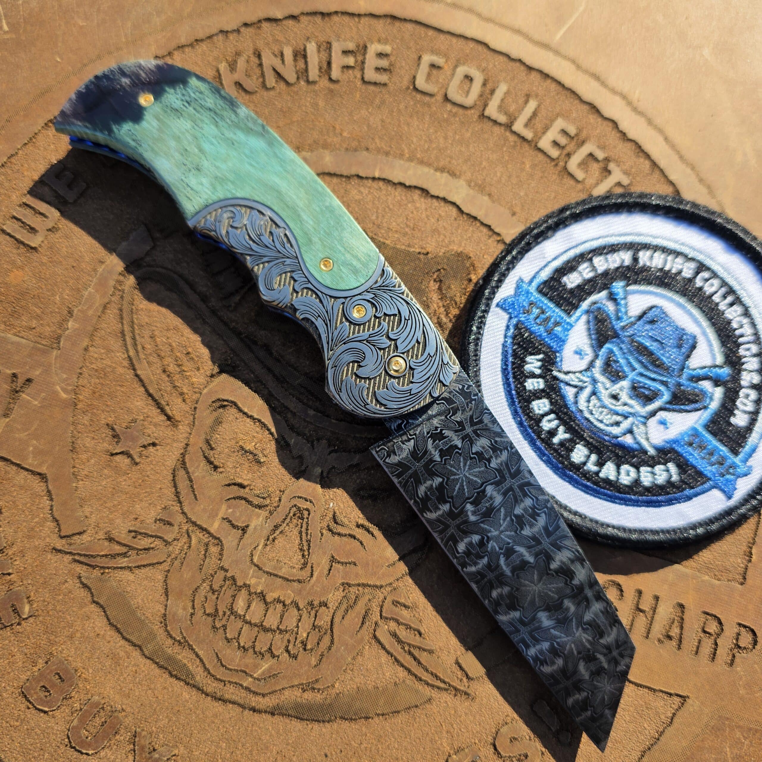 Reverse side of the Curt Zimmermann custom folder showing the titanium liners and gold screws.