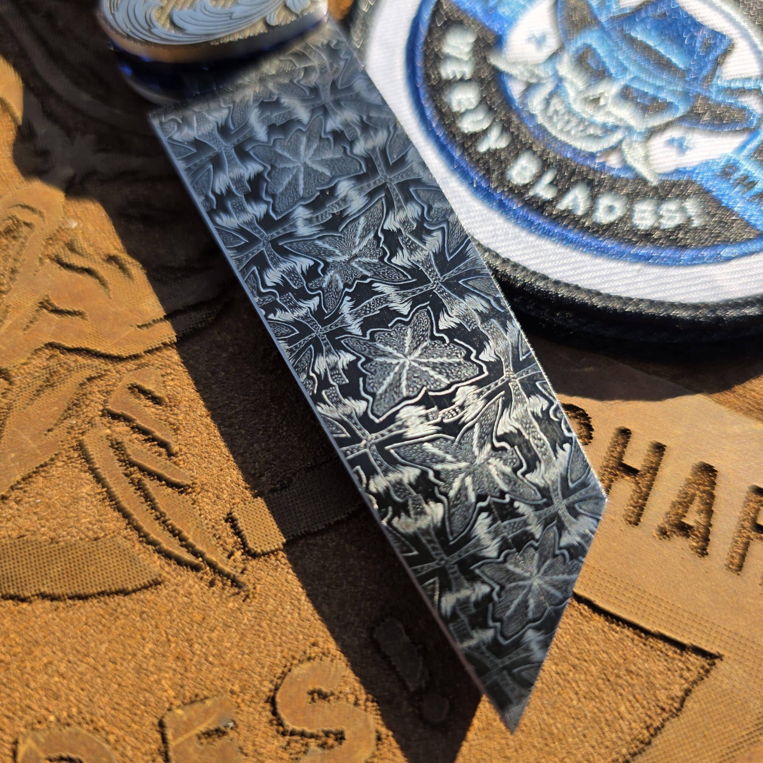 Close up of the Butterfly Damascus blade and 24k gold hardware on a Curt Zimmermann custom.