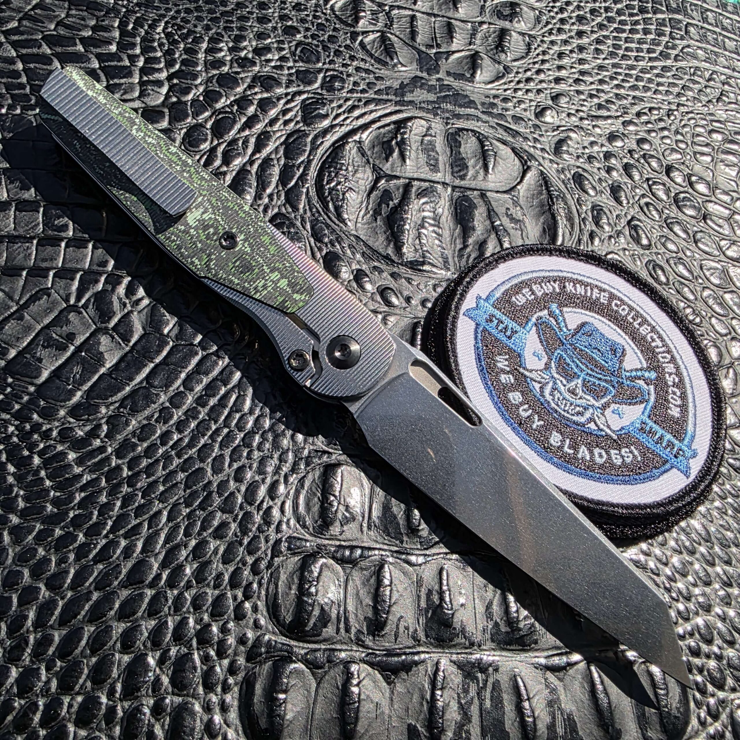Fully open lock-side view of Brown Knives Cortex V2 #329