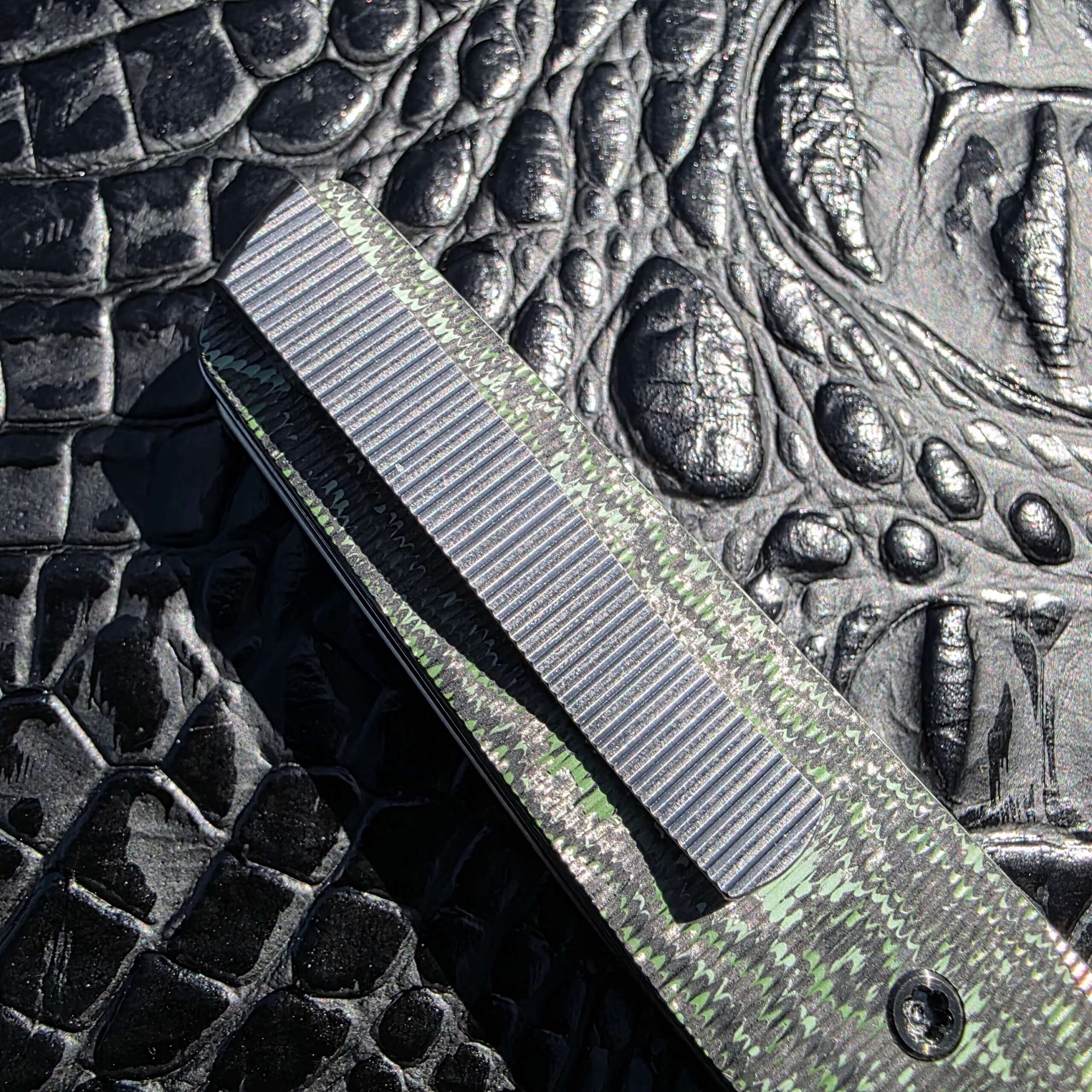 Titanium pocket clip with vertical milling on Brown Knives Cortex V2 #329