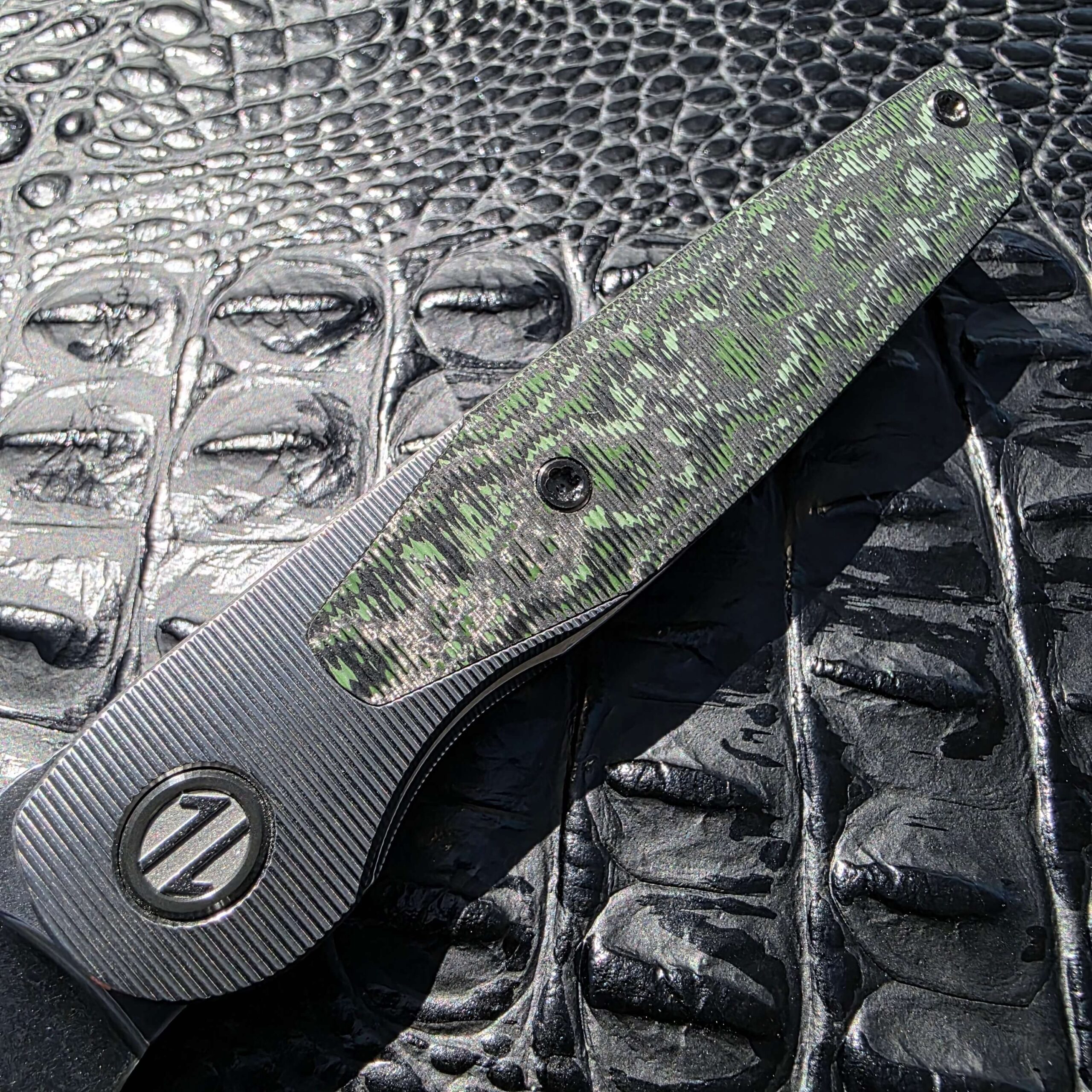 Show-side handle detail on Brown Knives Cortex V2 #329 with Fat Carbon Jungle Wear inlay