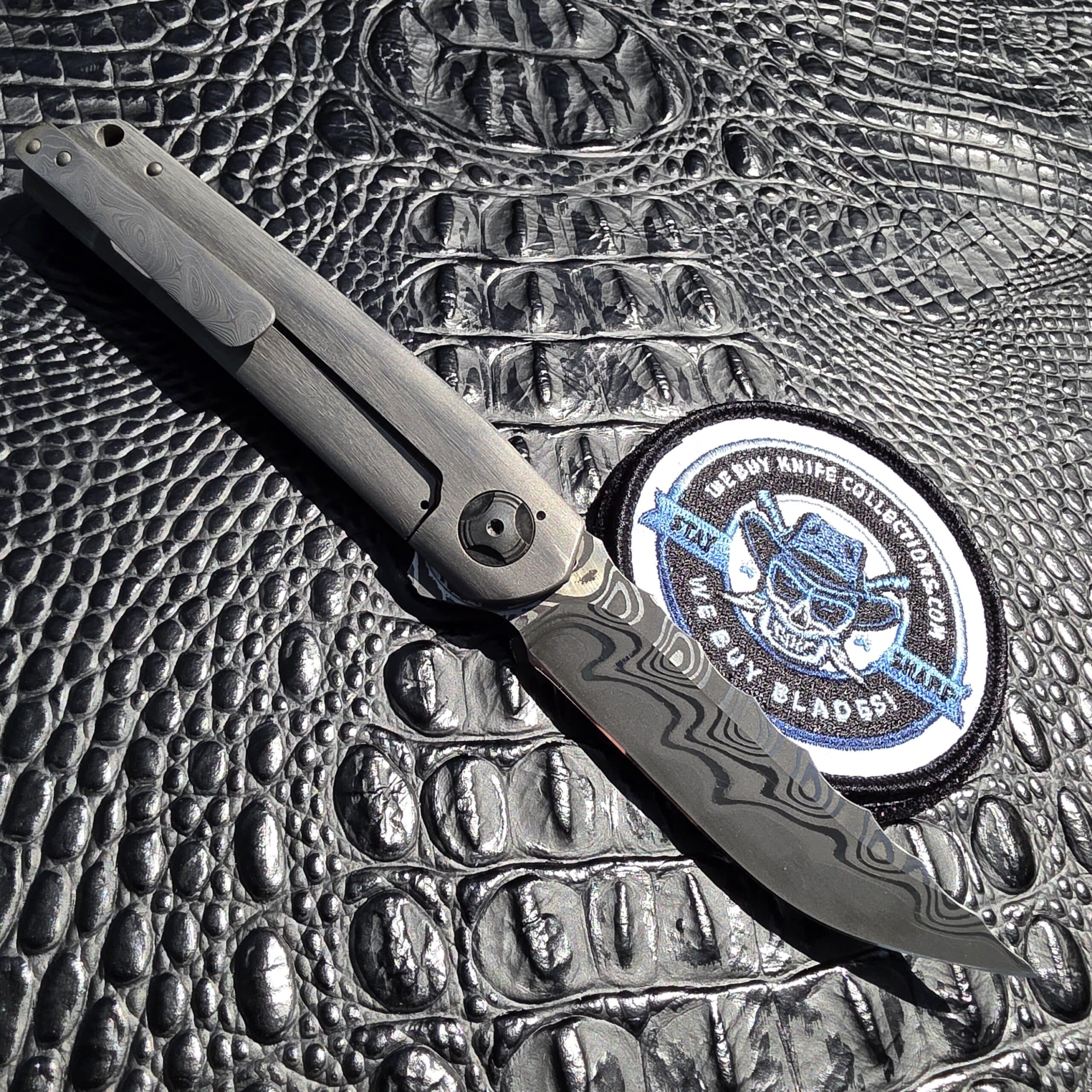 Open clip side of Darac Steel Quintus custom knife with San Mai clip