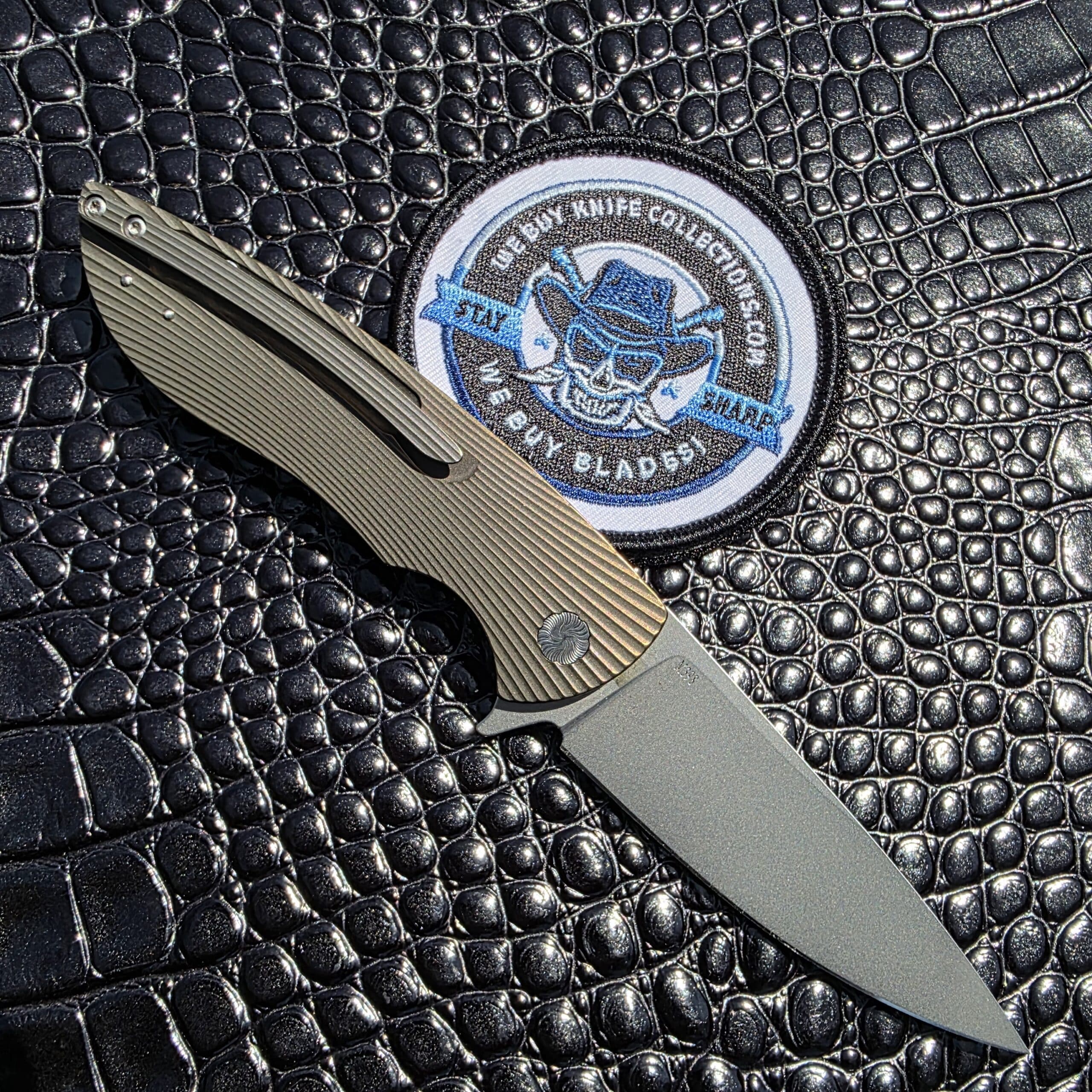 Clip-side view of Herman Knives Sting Flipper with tip-up titanium clip