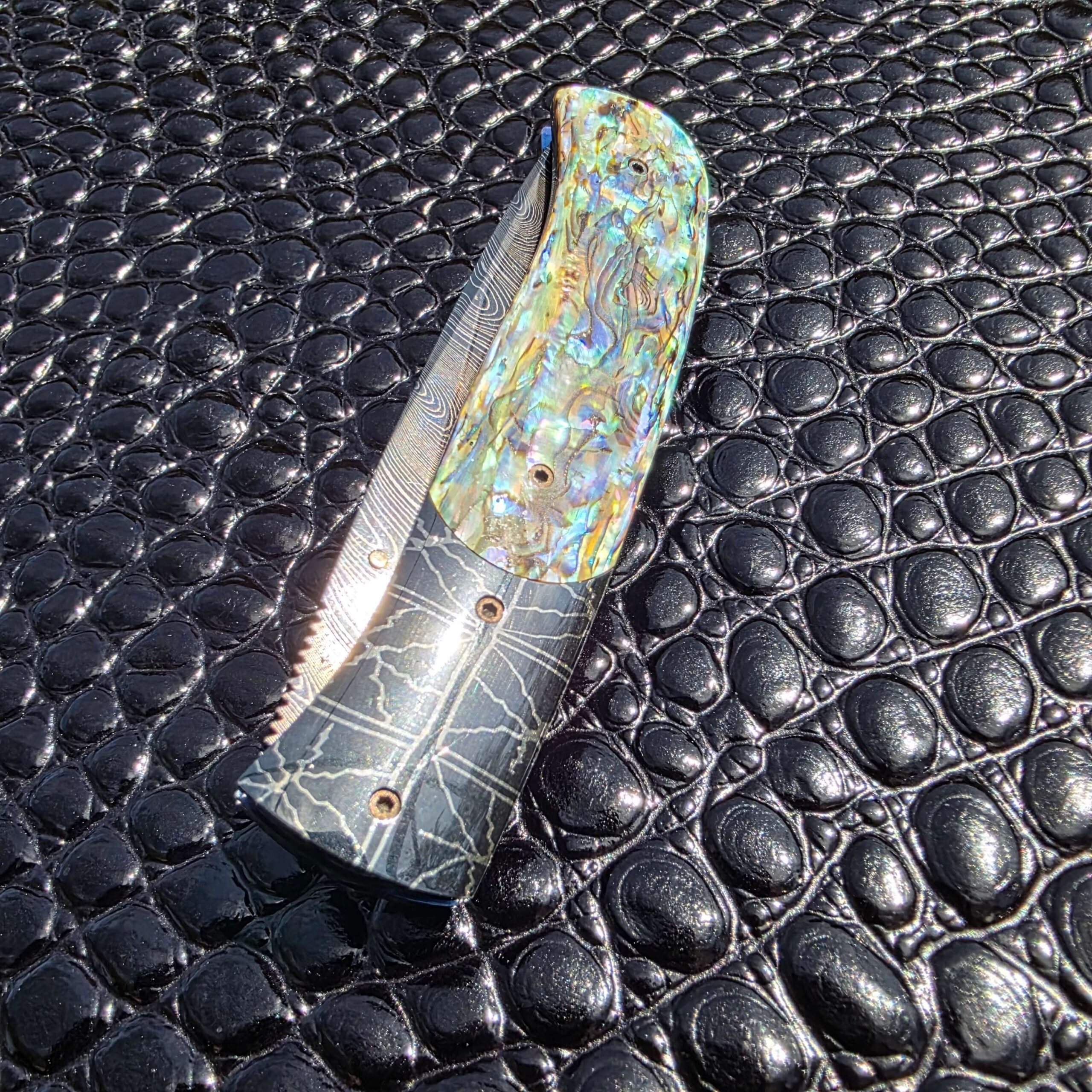 Blued Robert Eggerling mosaic Damascus bolster detail on Jeff Chaffee custom linerlock