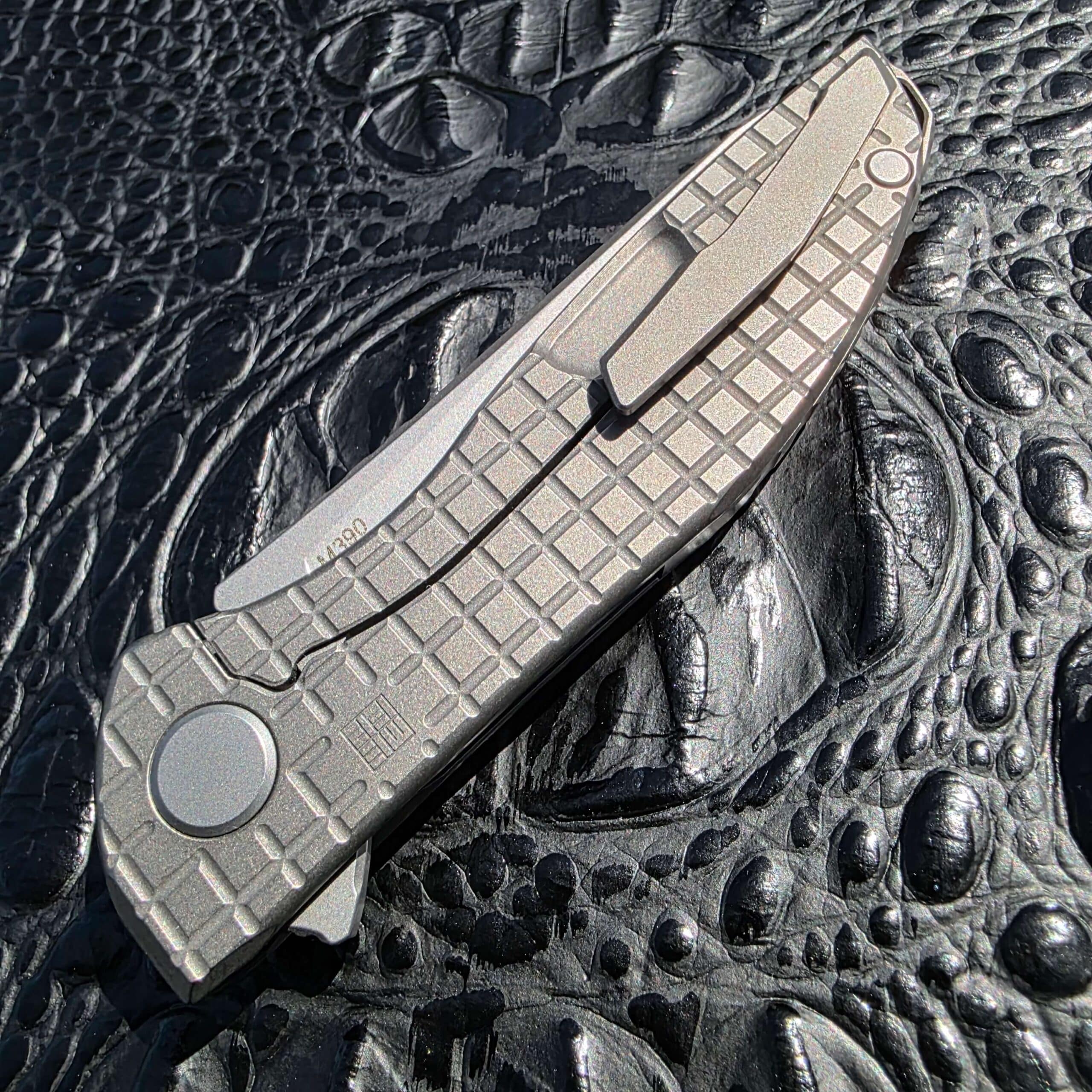 Titanium pocket clip detail on Shirogorov NeOn Zero Monkey Edge FRAG Pattern