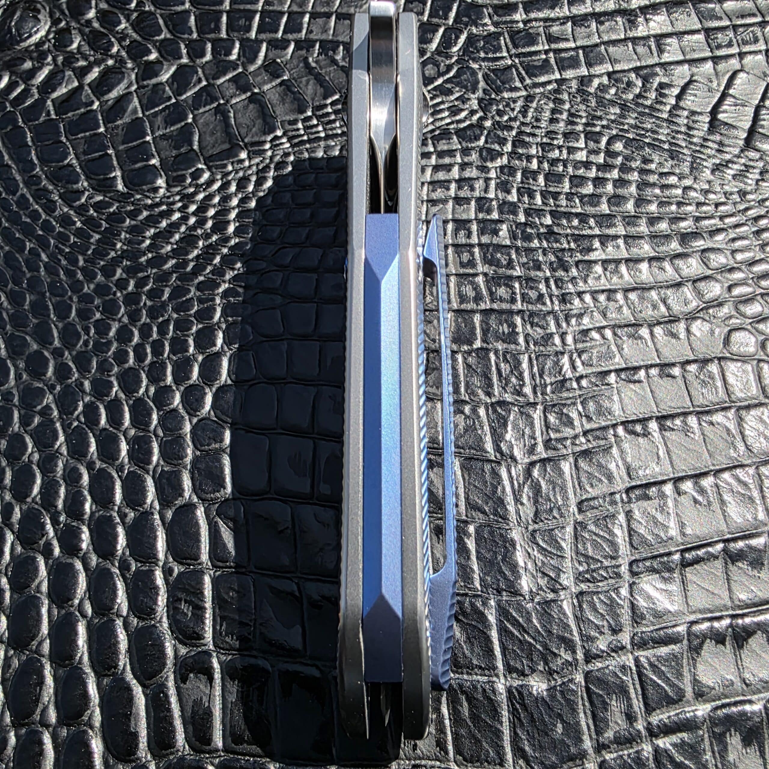 Blue anodized titanium backspacer on Skiff Made Blades Culprit