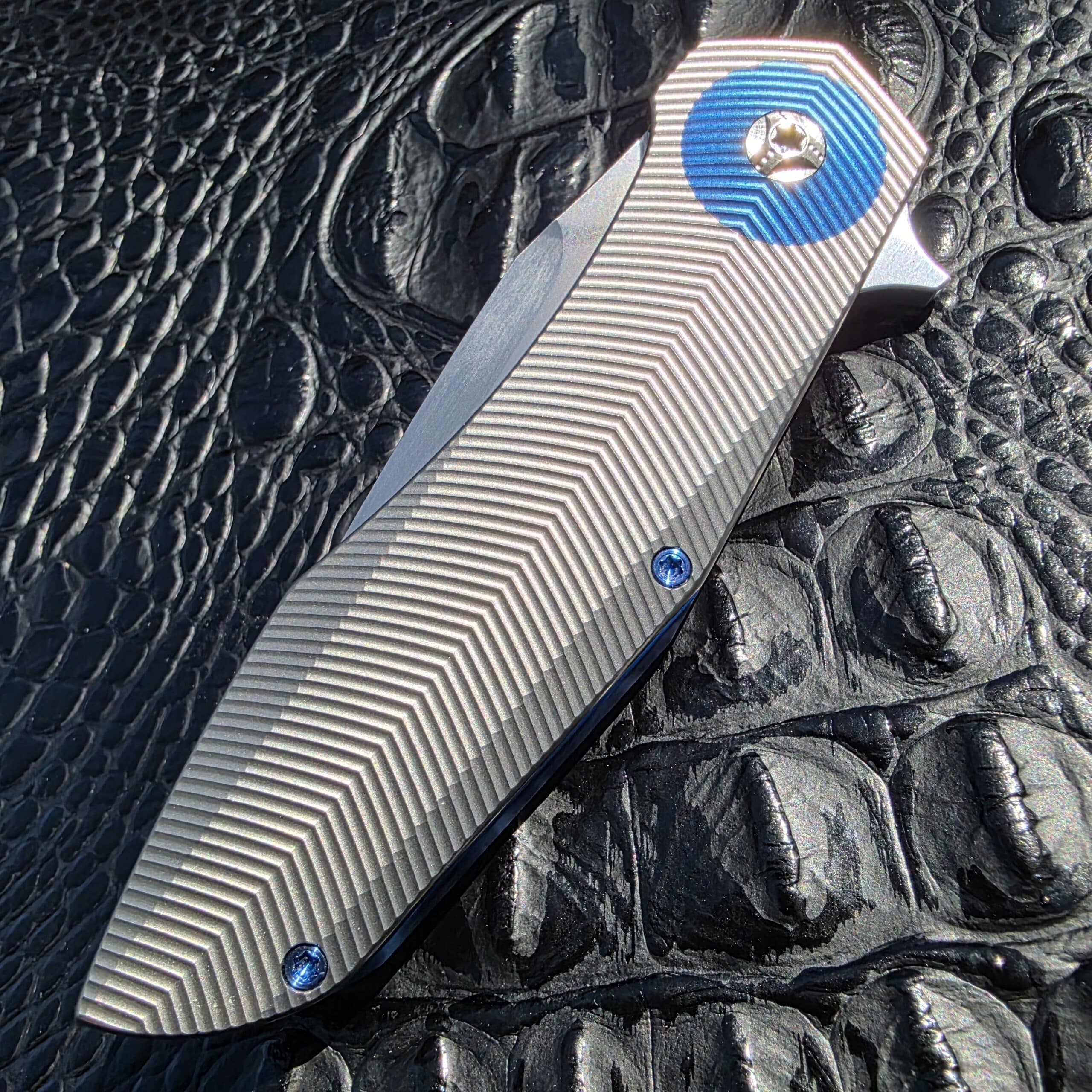 Closed show-side view of Skiff Made Blades Culprit with 3D milled titanium handle