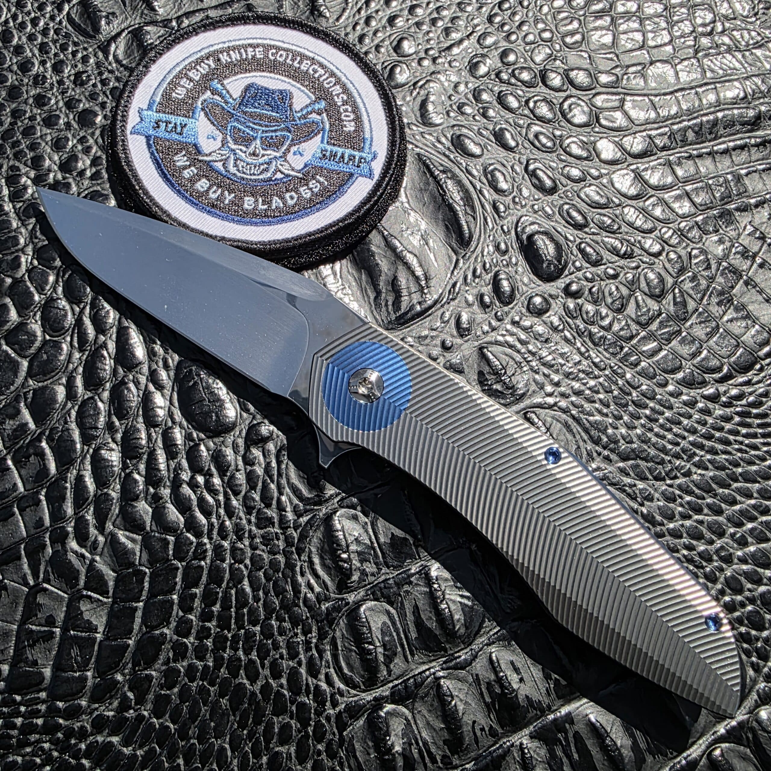 Skiff Made Blades Culprit with hand rub satin CTS-XHP blade and blue anodized titanium accents