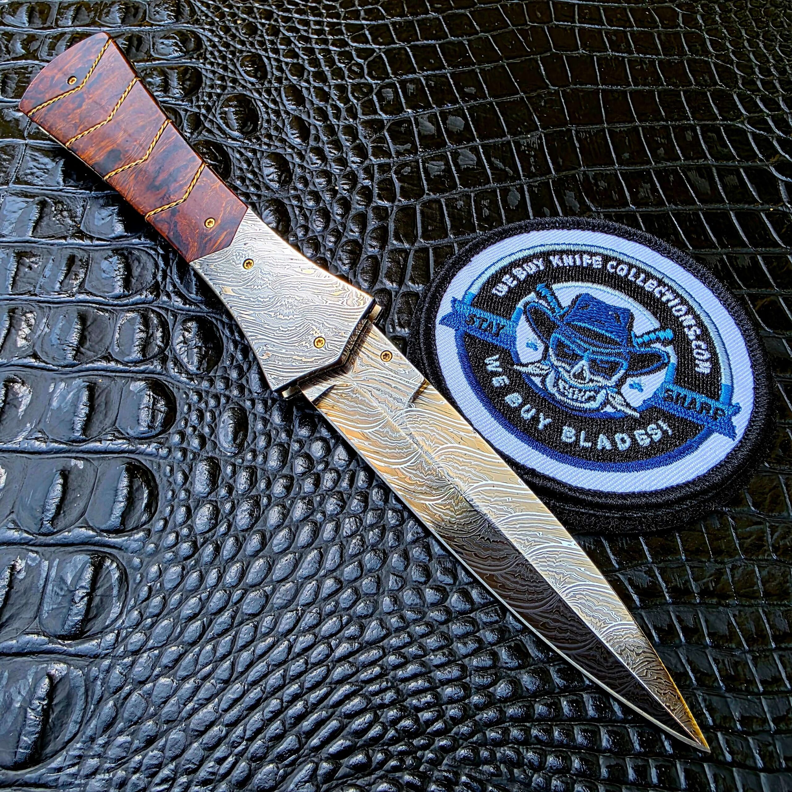 Open back side view of Bill Coffey Custom Folding Dagger with Damascus bolsters