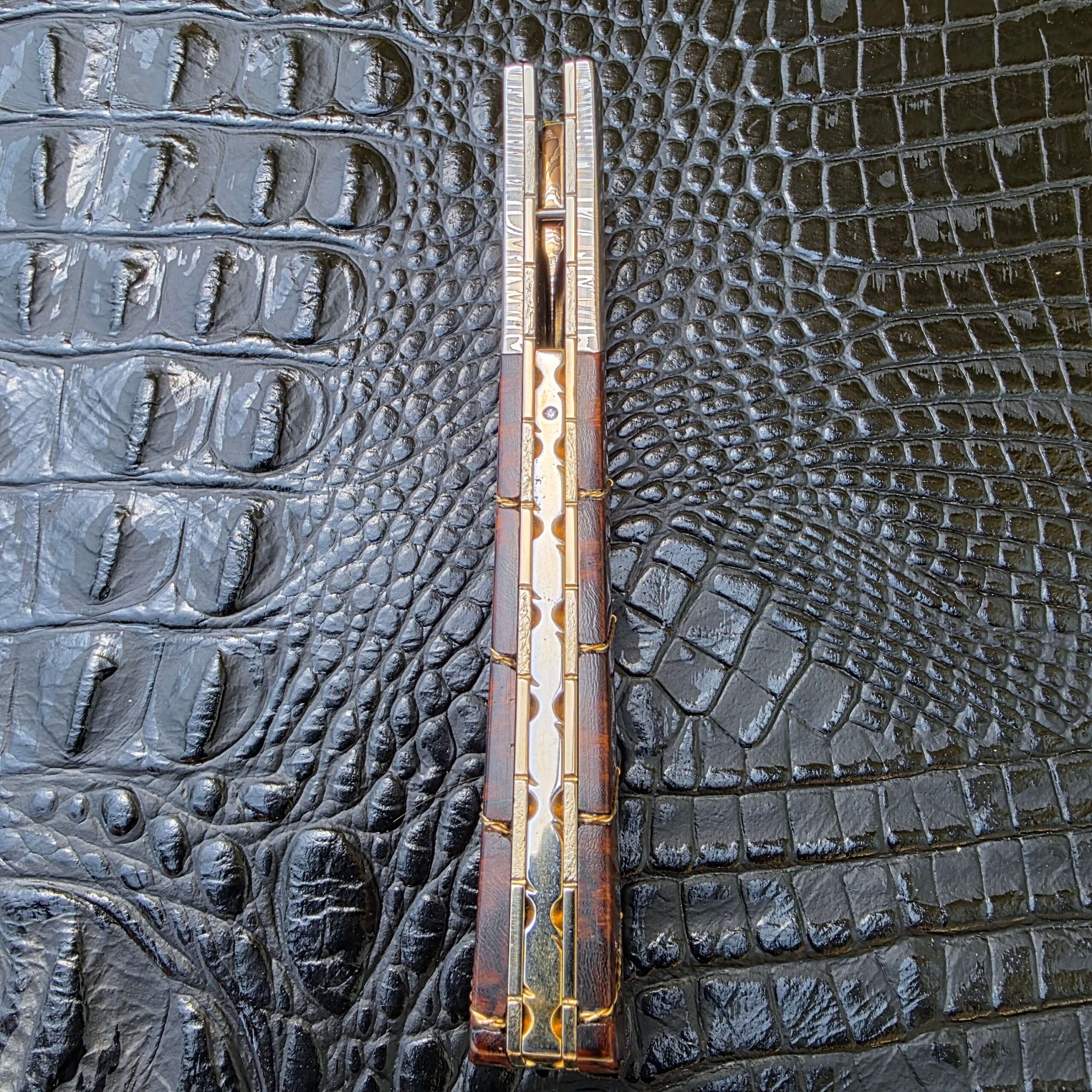 Stippled and anodized titanium liners on Bill Coffey Custom Folding Dagger
