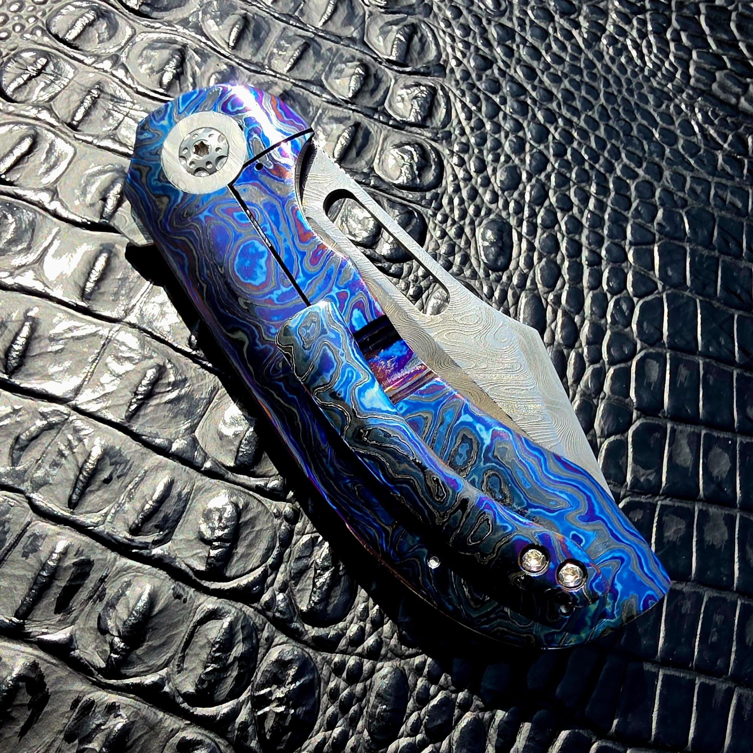 Closed clip-side view of Clark Blades Patriot with Black Timascus pocket clip