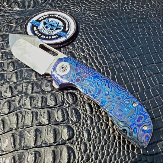 Clark Blades Patriot with Damasteel blade and Black Timascus scales