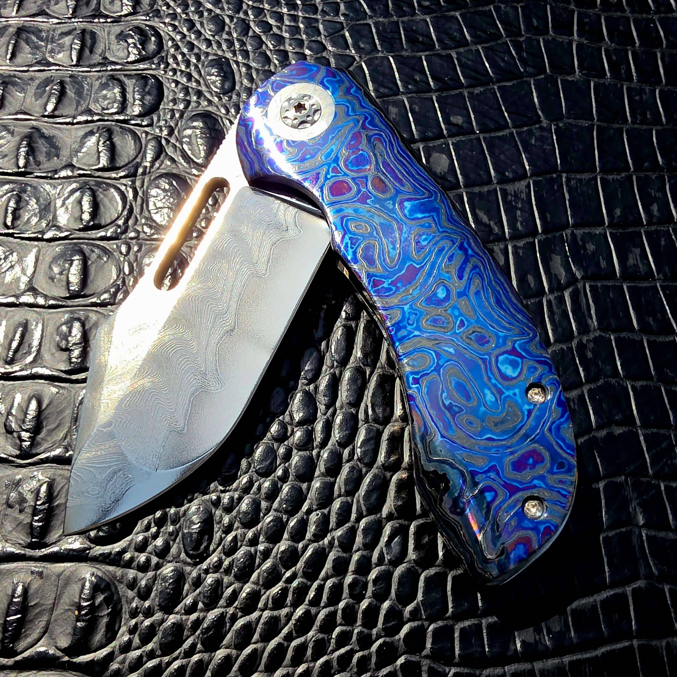 Titanium pivot detail on Clark Blades Patriot custom folder