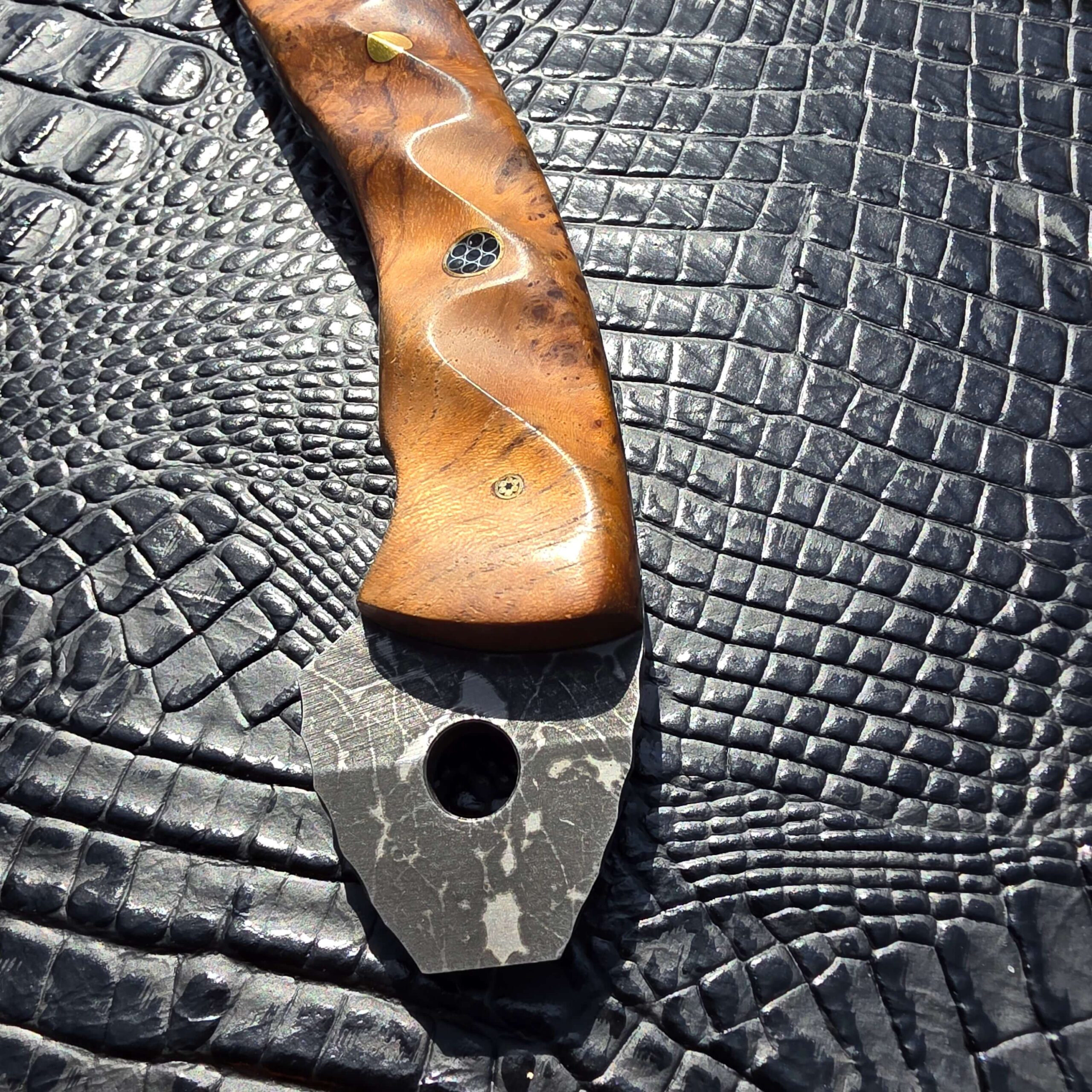Lanyard hole detail on Half Face Blades Bleeding Heart Hawk