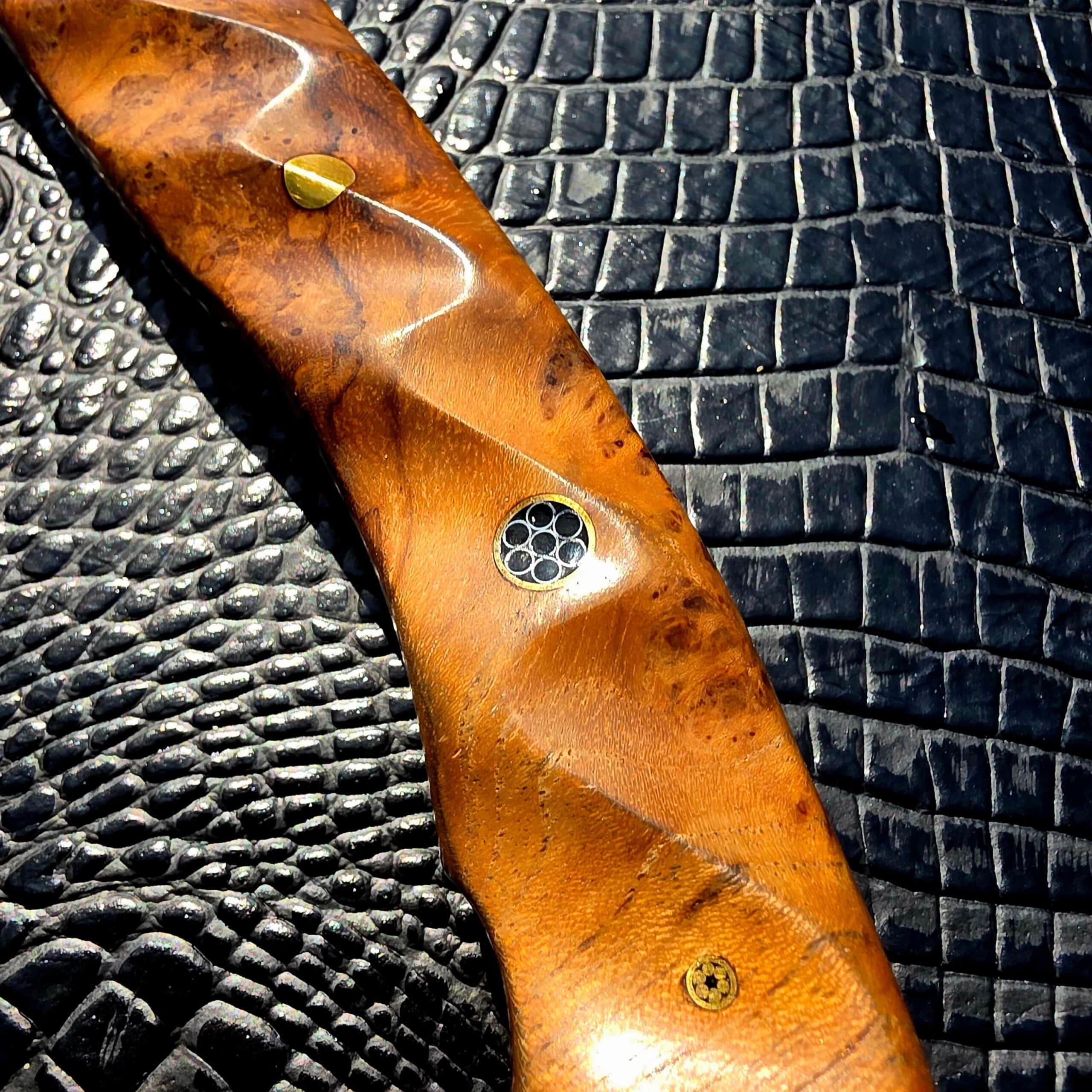 Mosaic pin detail on Half Face Blades Bleeding Heart Hawk handle