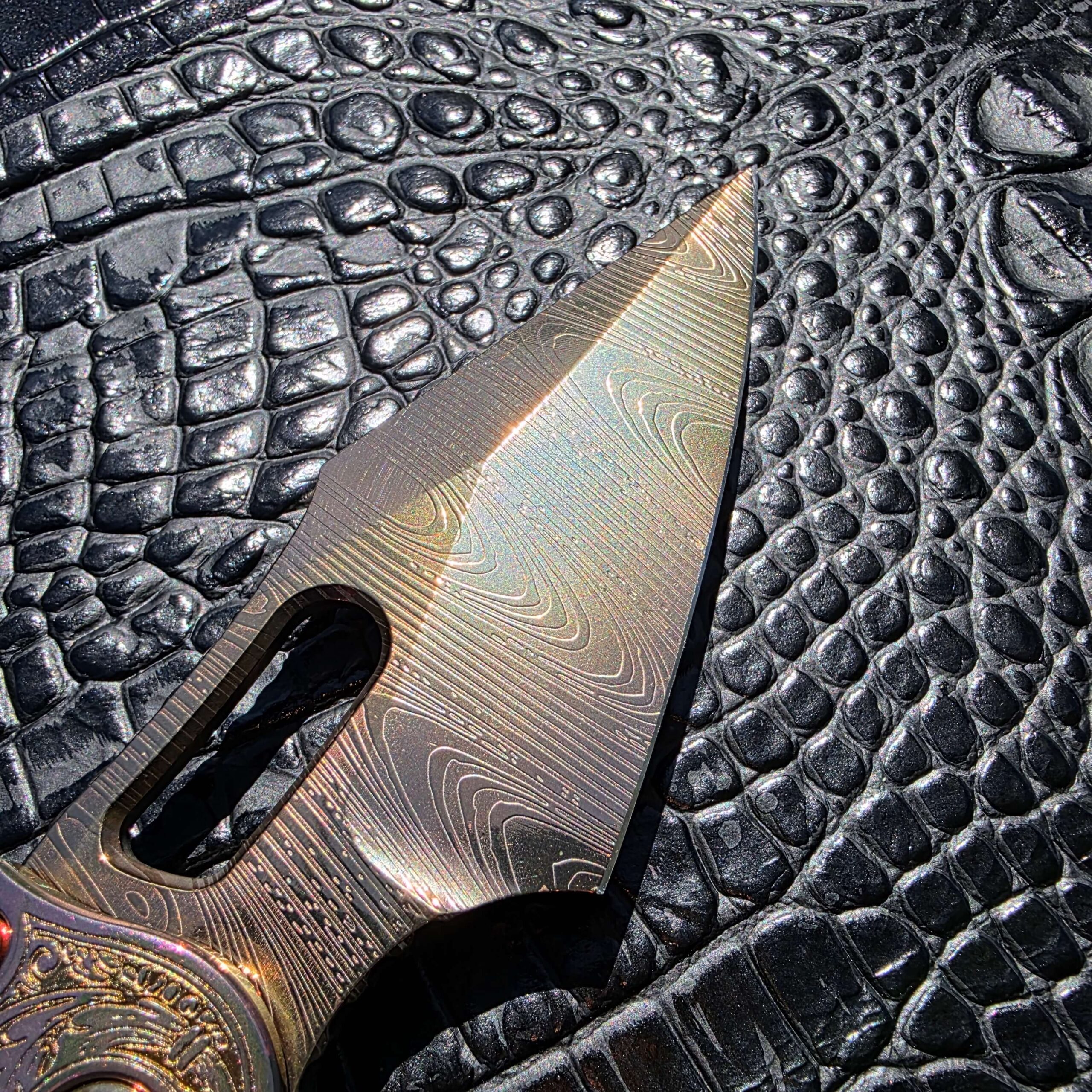 Engraved blade on Microtech Stitch customized by Todd Smith