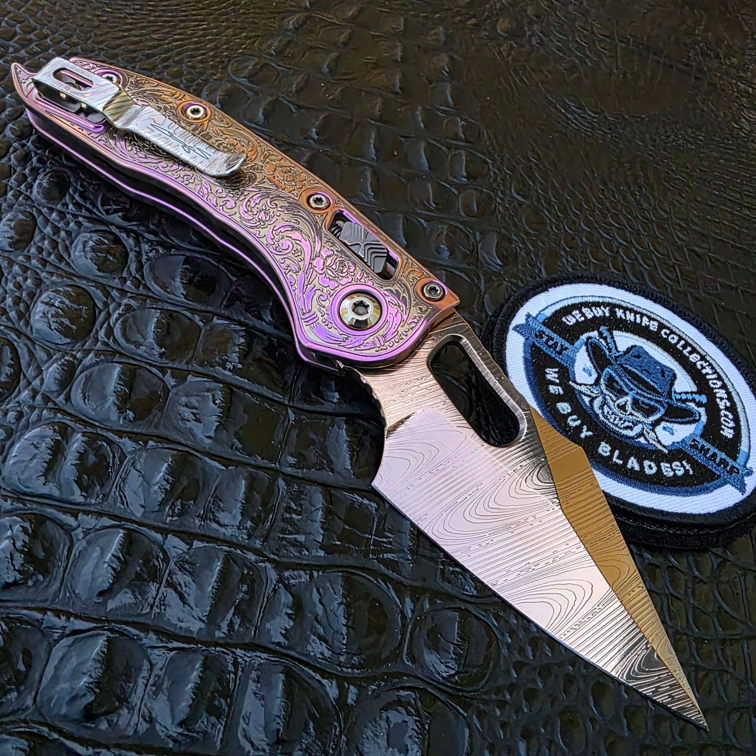 Open clip-side view of customized Microtech Stitch with etched cli