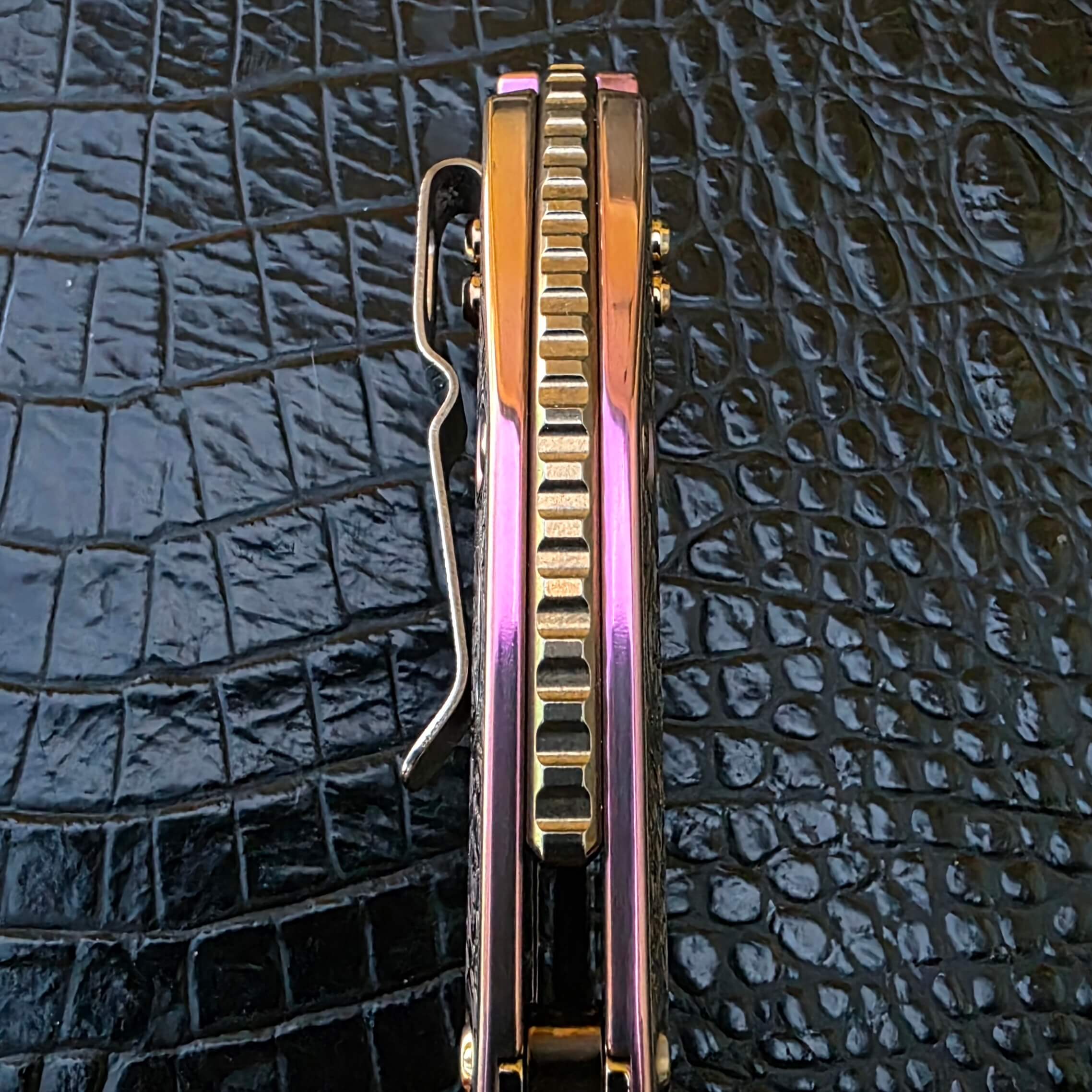 Spine detail on customized Microtech Stitch automatic knife