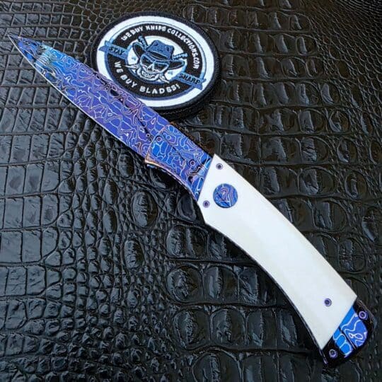 Rainy Vallotton Custom Hunter with Chad Nichols Intrepid Damascus and white linen Micarta
