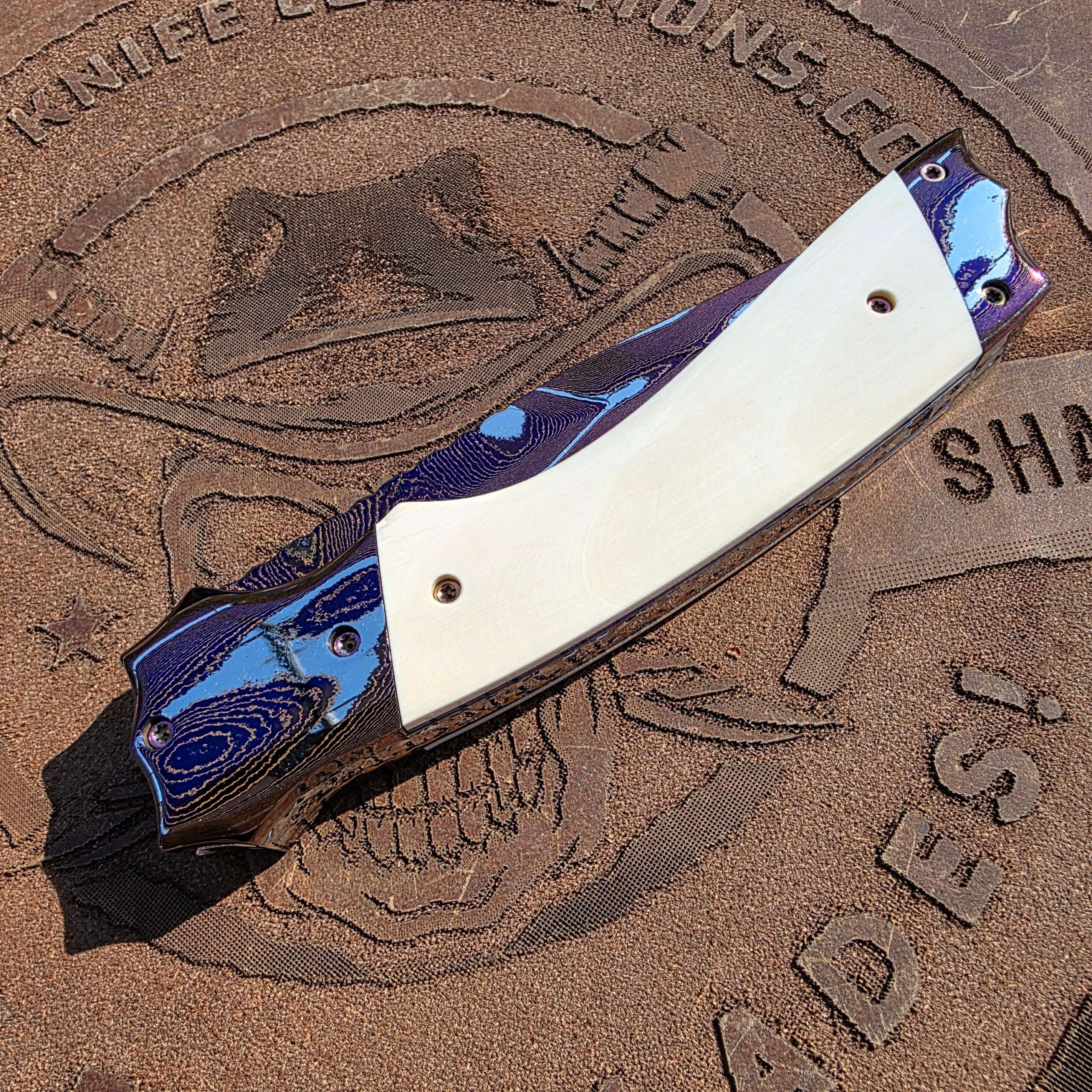 Closed back side view of Rainy Vallotton Tempest custom automatic