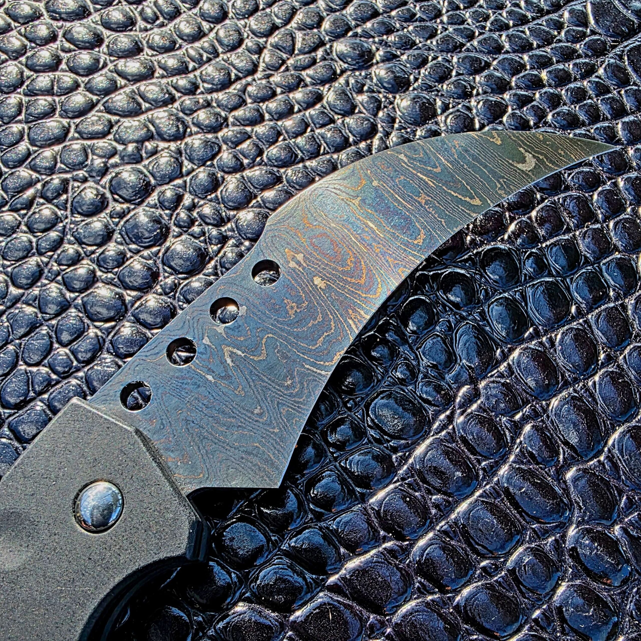 Custom Damascus hawkbill blade on Reese Weiland Hawk Gen II Automatic