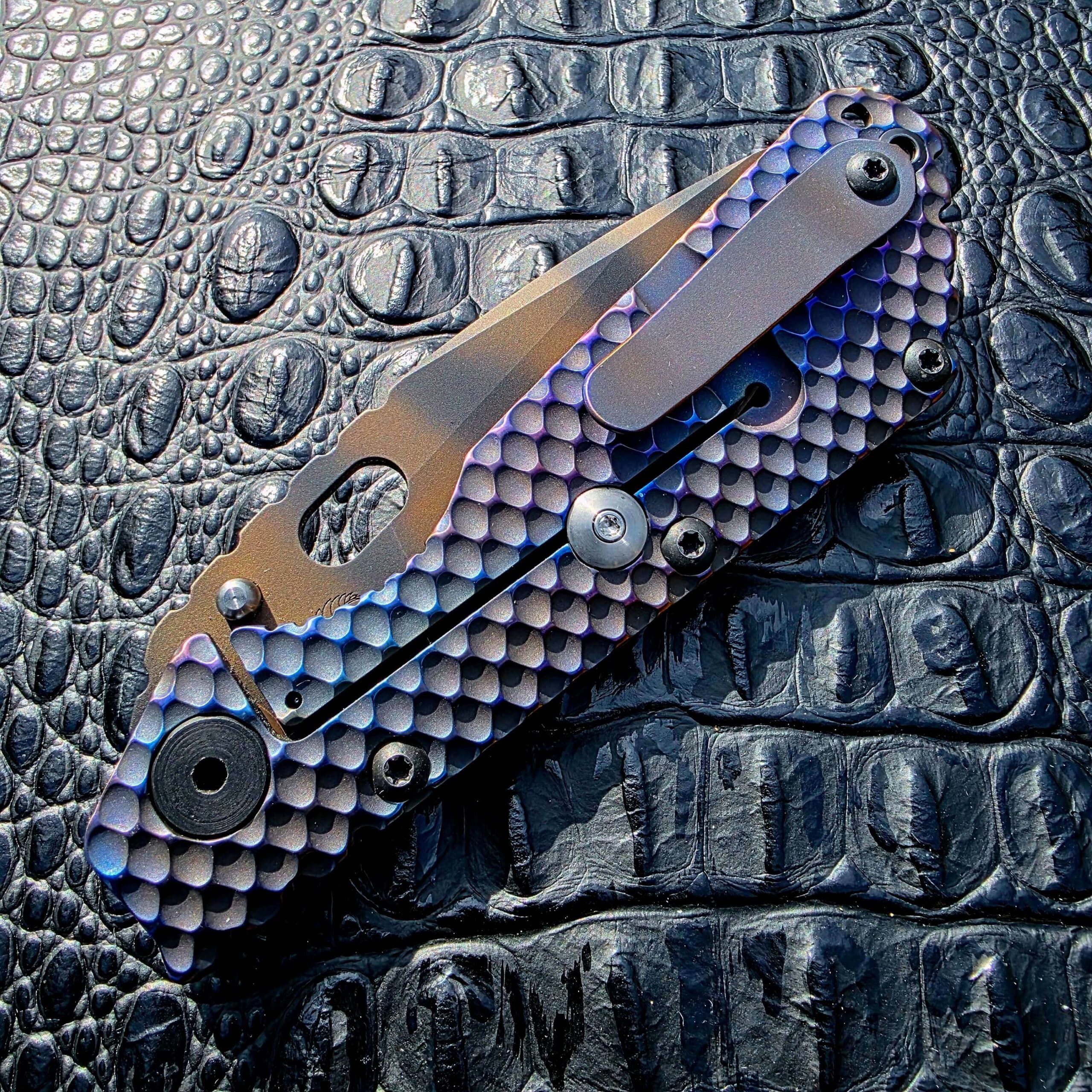 Closed clip-side view of Strider SMF Full Titanium DGG with titanium pocket clip