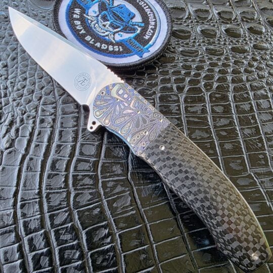 André Thorburn L48 Flipper custom knife with carbon fiber and engraved zirconium