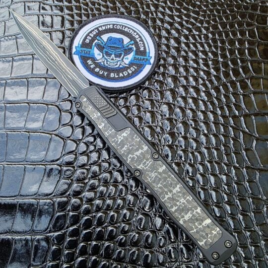 Heretic Cleric II Custom S/N 047 open with Baker Forge Damascus blade and Fat Carbon Silver Snakeskin inlays.